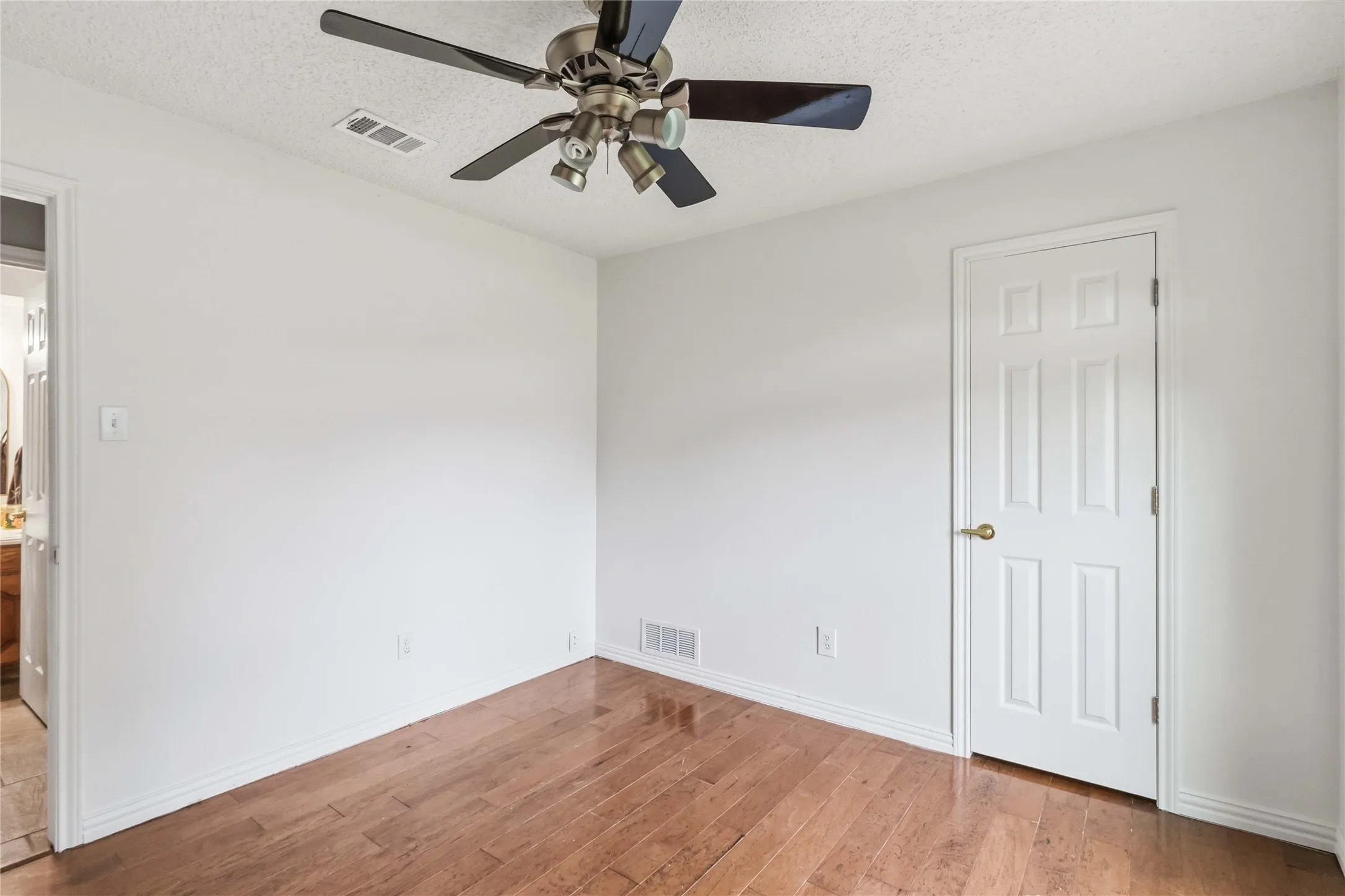 Bedroom at 200 Sunny Crest Dr, Murphy TX in the Timbers 3 community featuring wood flooring and neutral finishes.