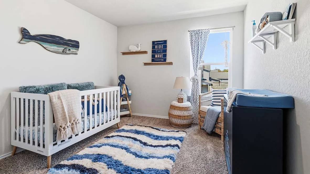 Carpeted room with a window featuring privacy blinds