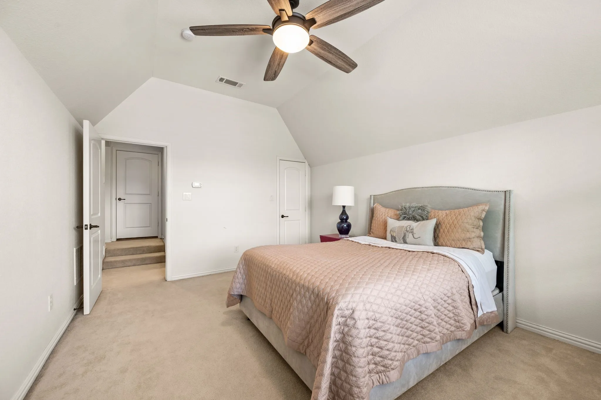Alternate view of bedroom highlighting ample wall space