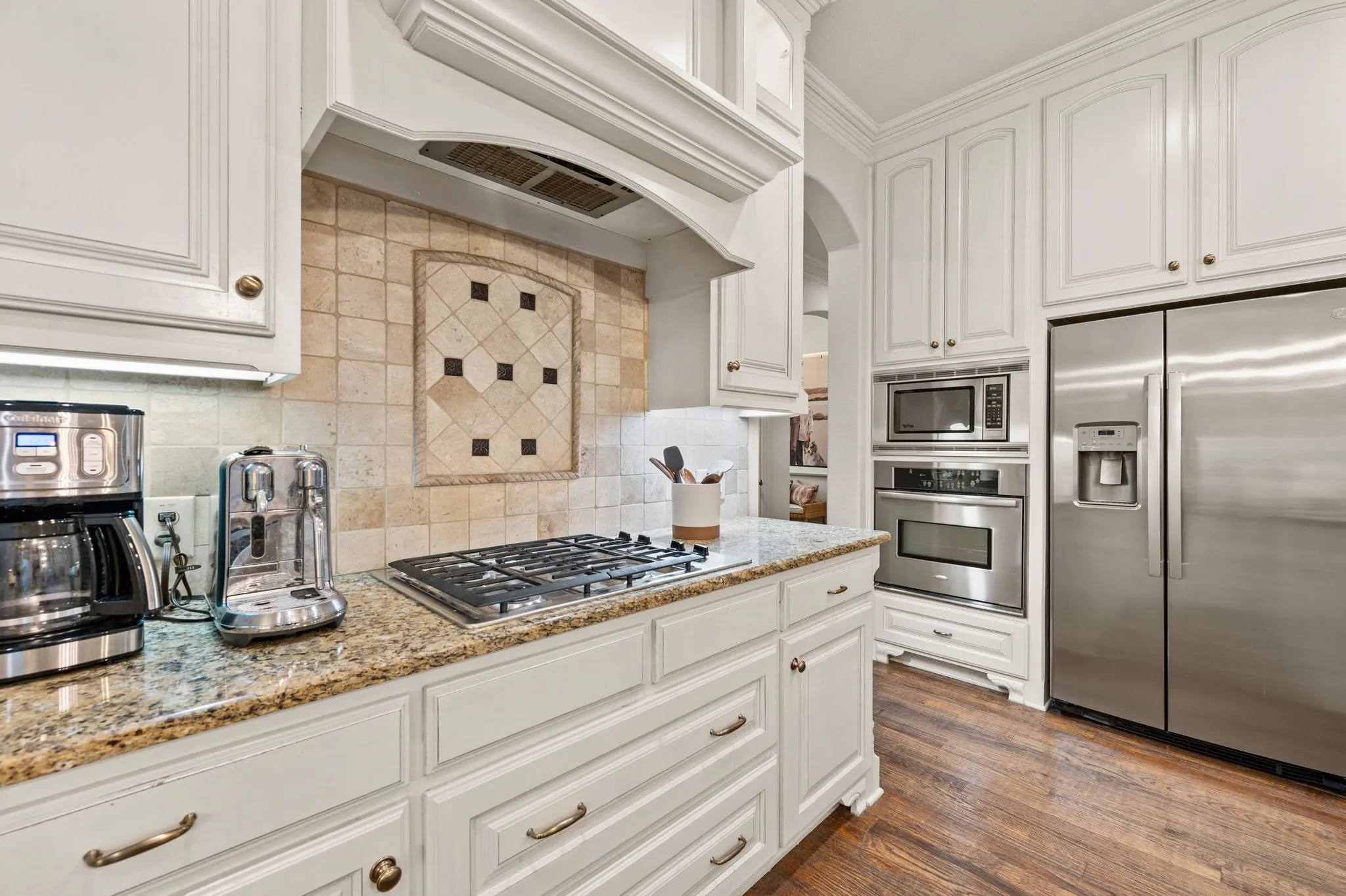 Alternate kitchen angle showcasing abundant counter space and functional layout.