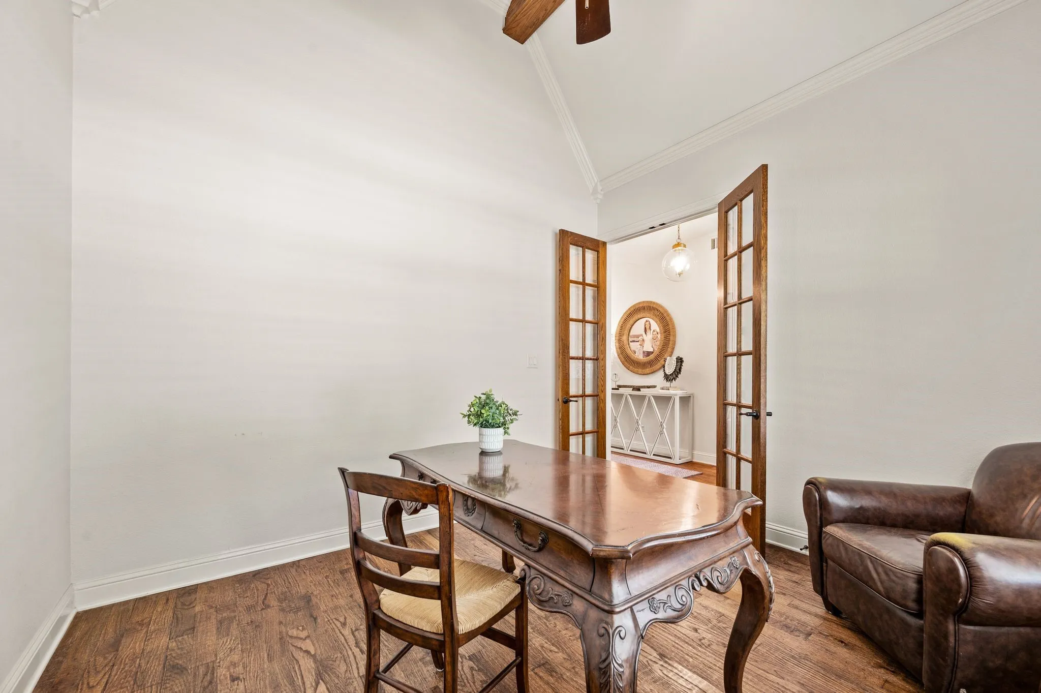 Alternate view of flex space / office  with French doors and rich hardwood flooring.