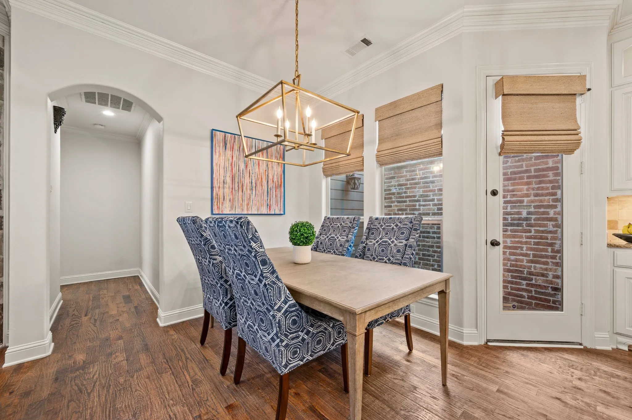 Bright dining space with modern chandelier and open layout ideal for entertaining.