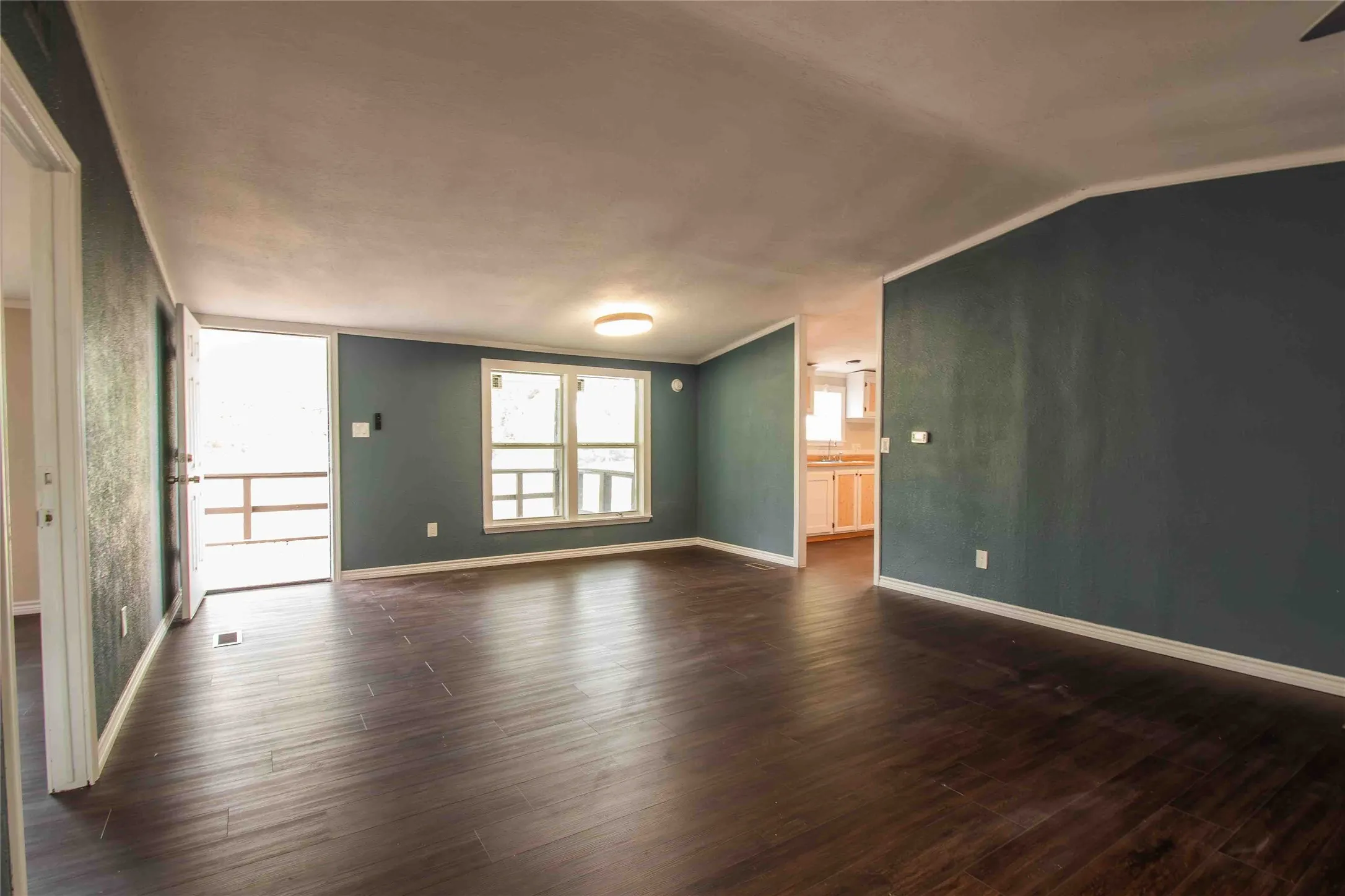 View of LR toward the front door entrance