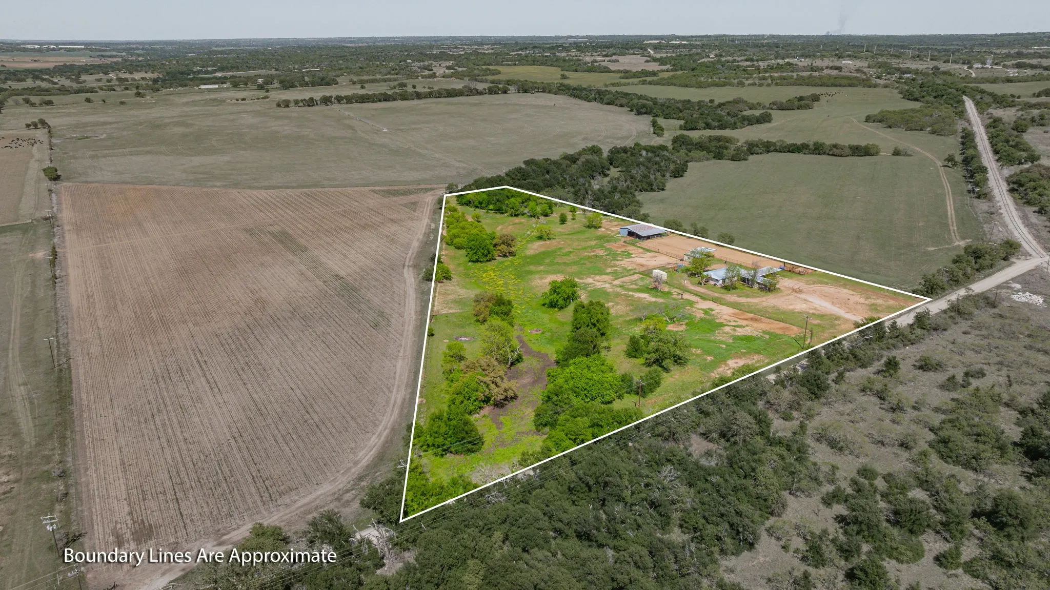 View of rural area featuring property parcel outlined and large plots for crops