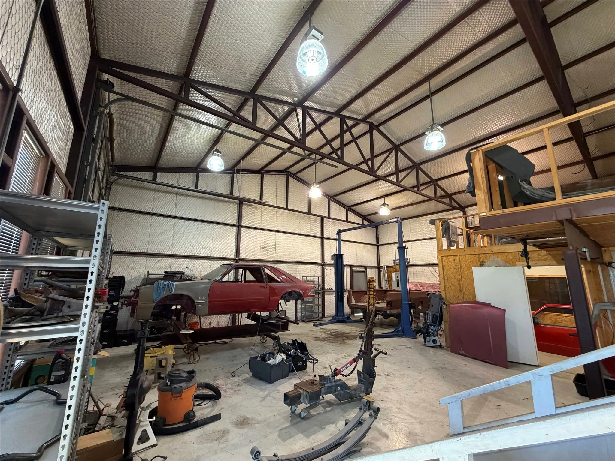 Garage featuring metal wall
