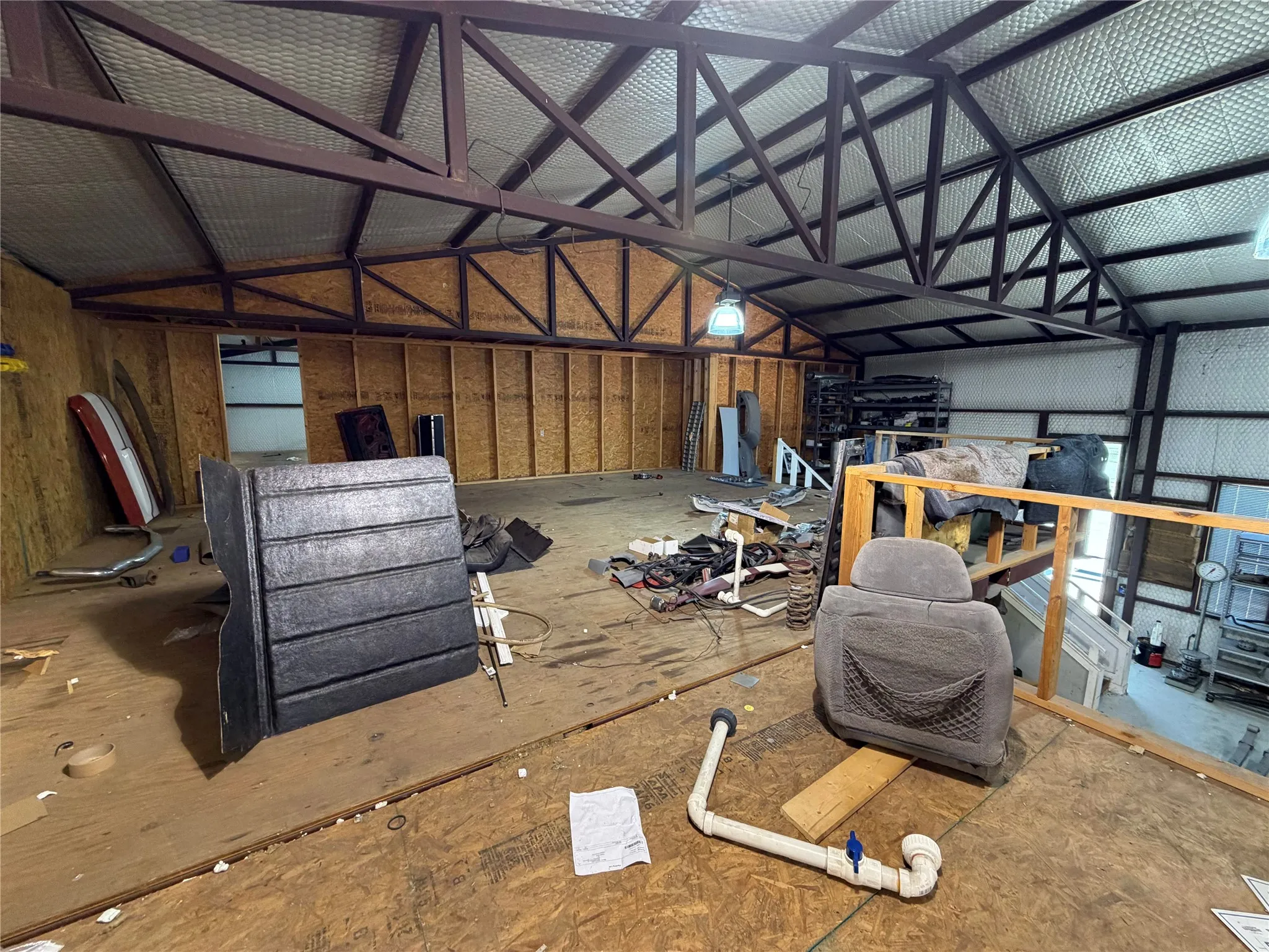 Miscellaneous room with lofted ceiling