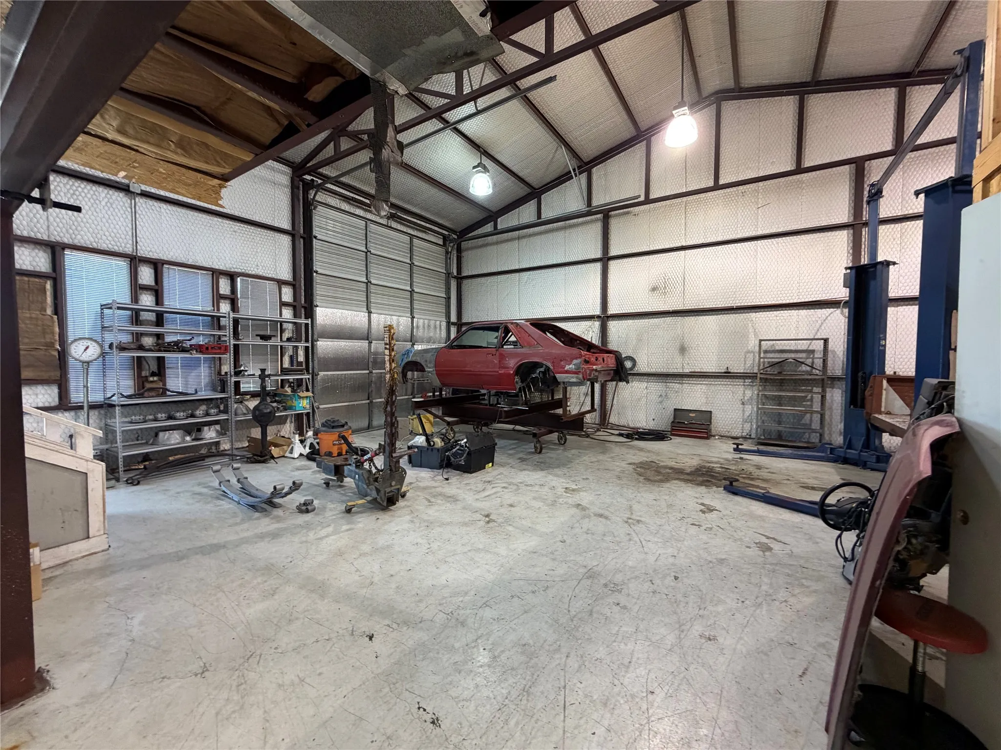 Garage featuring metal wall