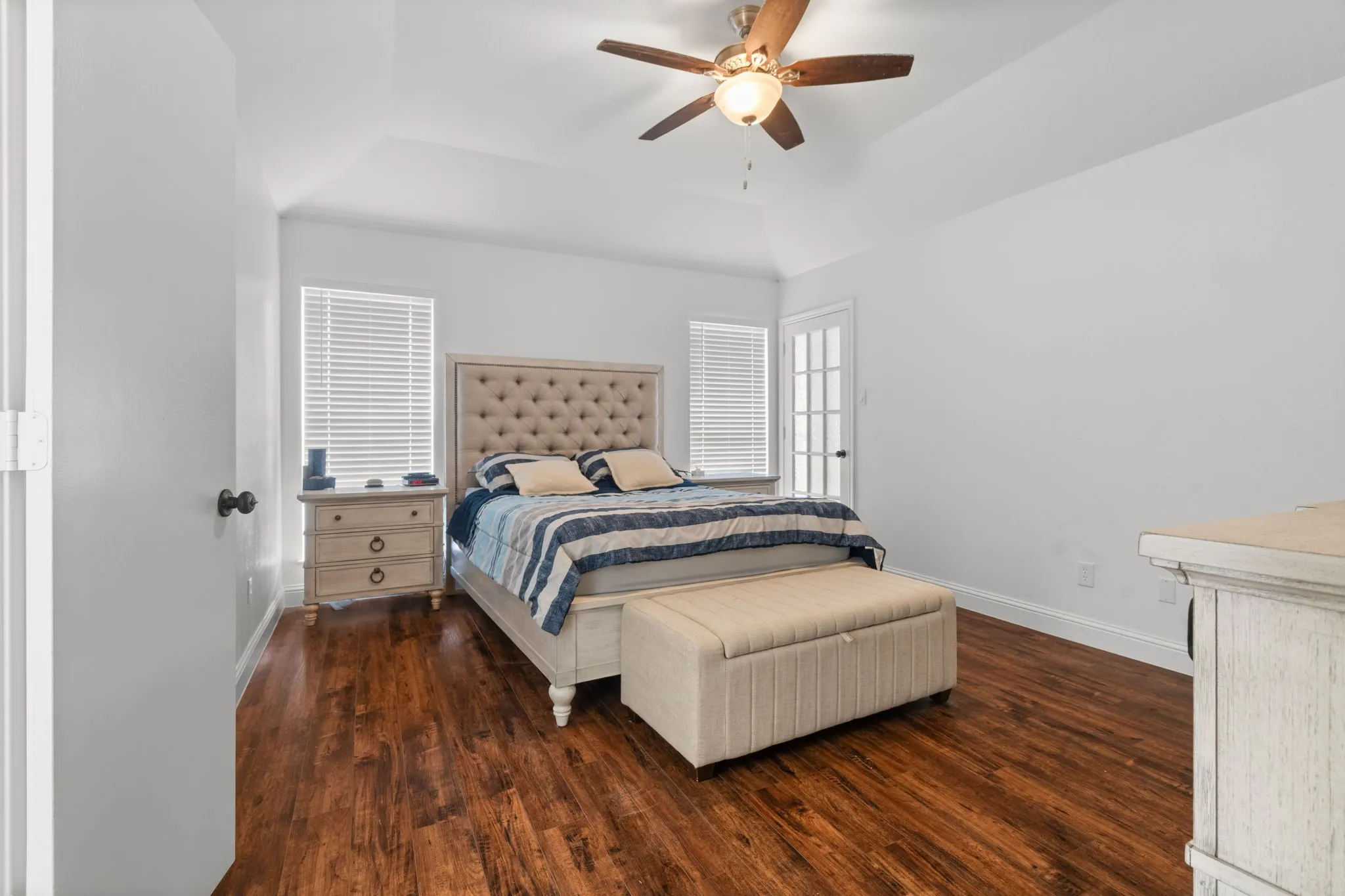 Bedroom featuring dark wood-style floors and a ceiling fan