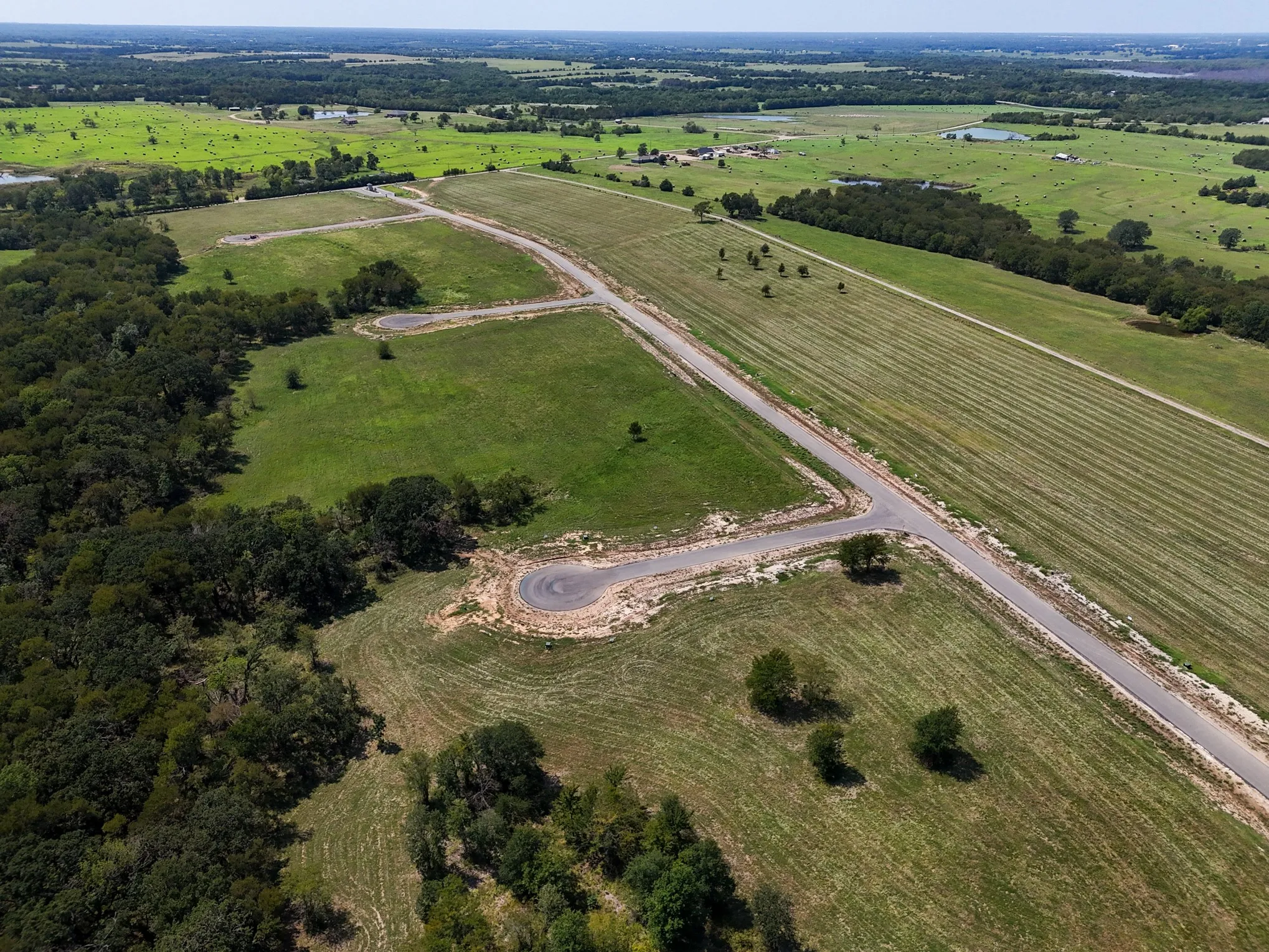 Aerial view of property and surrounding area featuring rural landscape