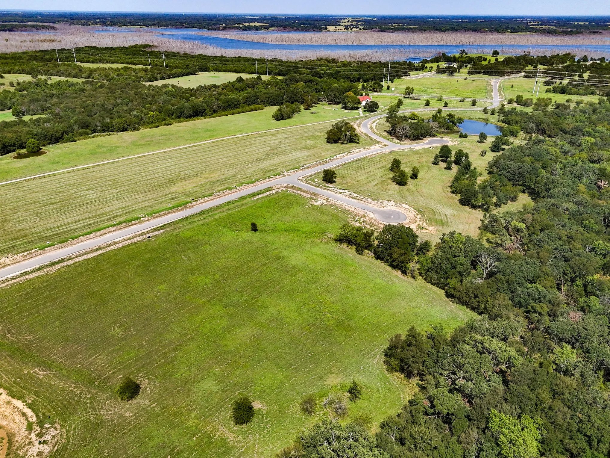 Aerial view of property's location with a nearby body of water