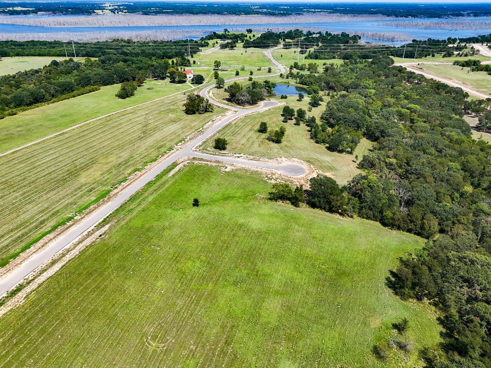 Aerial overview of property's location with a large body of water