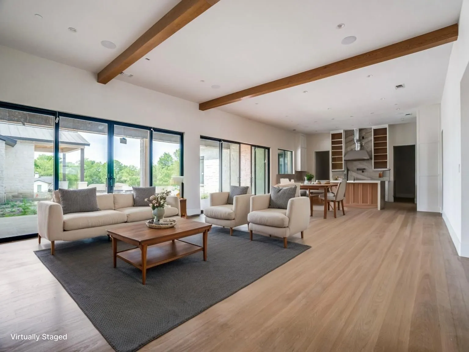 Flowing floorplan from the living room to the dining room and kitchen beyond.  This is the heart of the home. This photo is virtually staged.