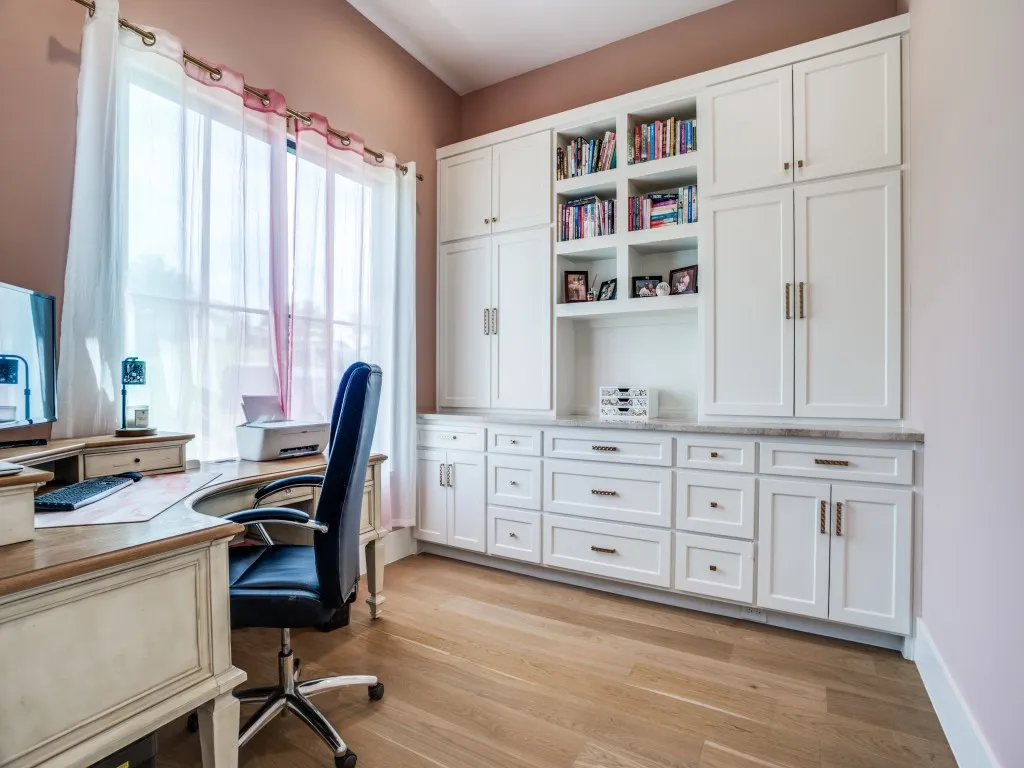 Guest house includes a study with built in cabinetry.