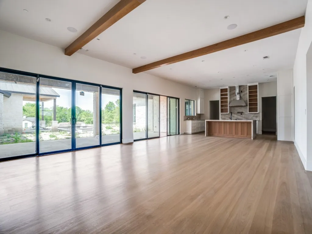The heart of the home is the warm and inviting living room, dining area, and chef's kitchen.