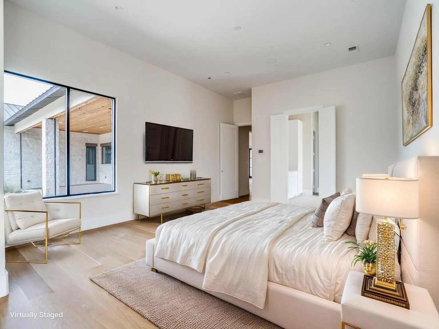 The primary suite has a large sitting room, private patio access, and overlooks the pool.