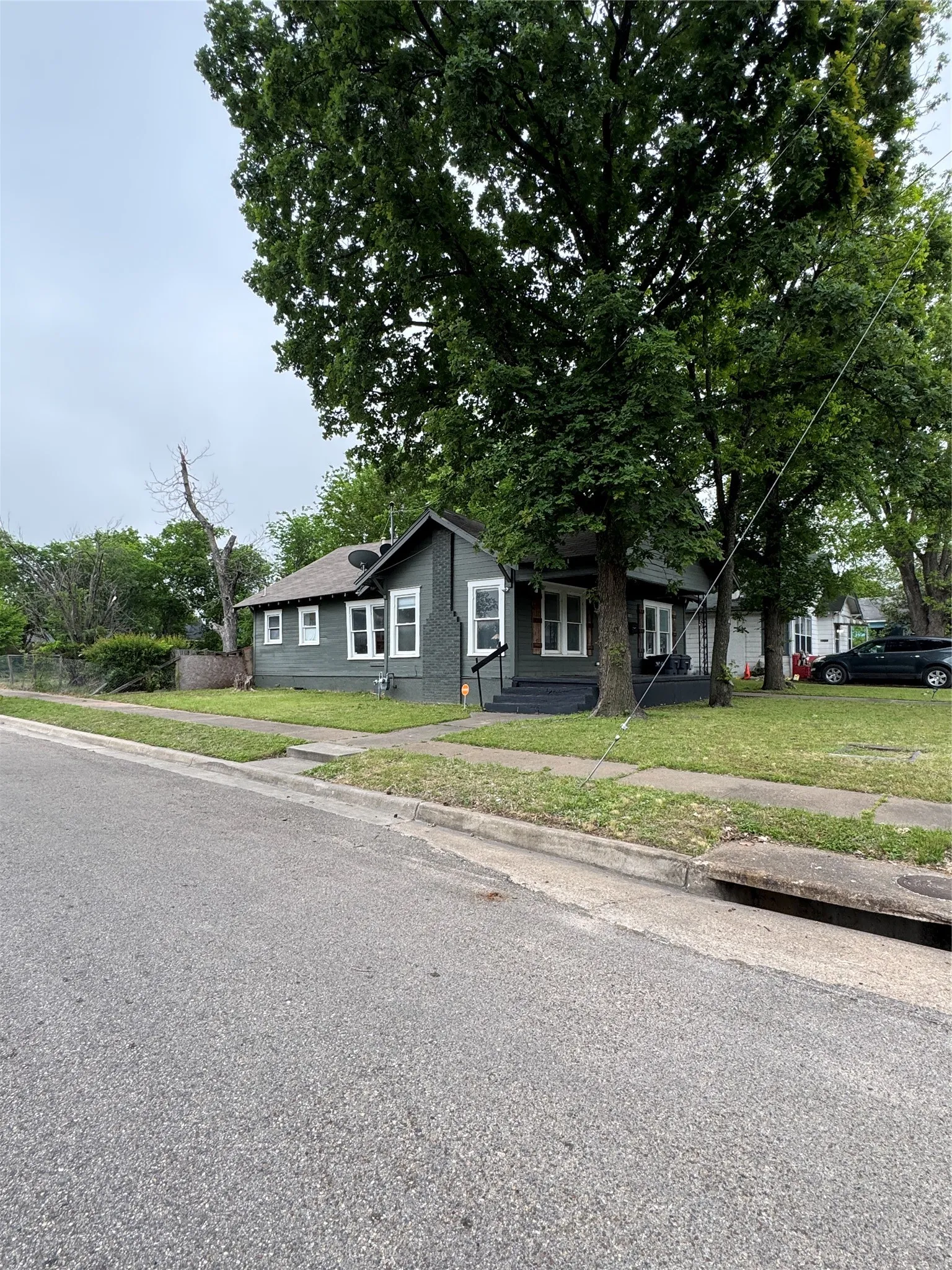 Bungalow-style house featuring a front yard