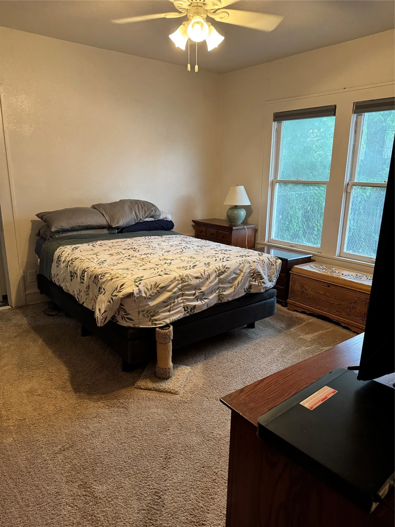 Bedroom featuring carpet floors and ceiling fan