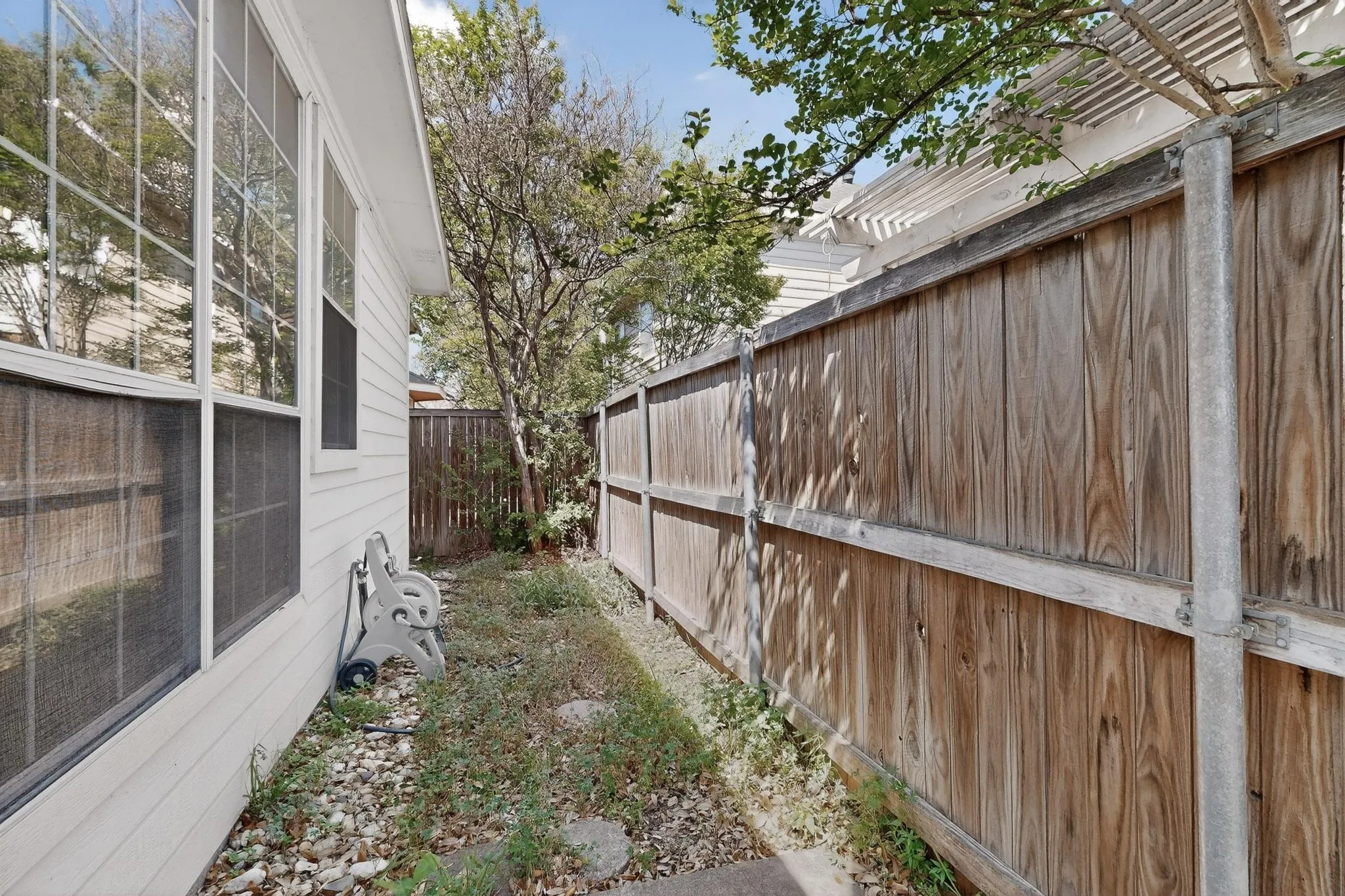View of fenced backyard