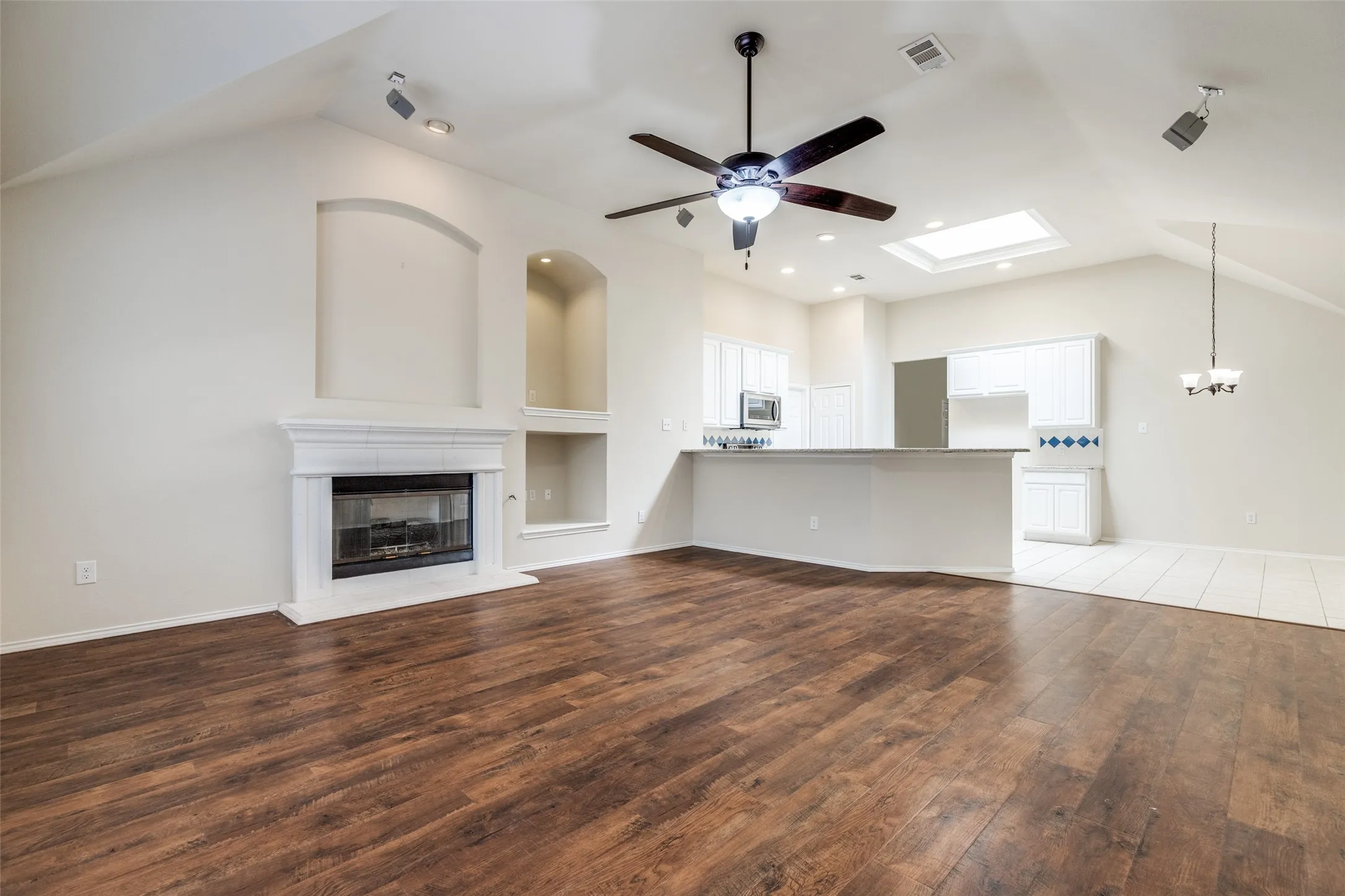 Engineered hardwoods, and lots of architectural detail, also found at primary living area.