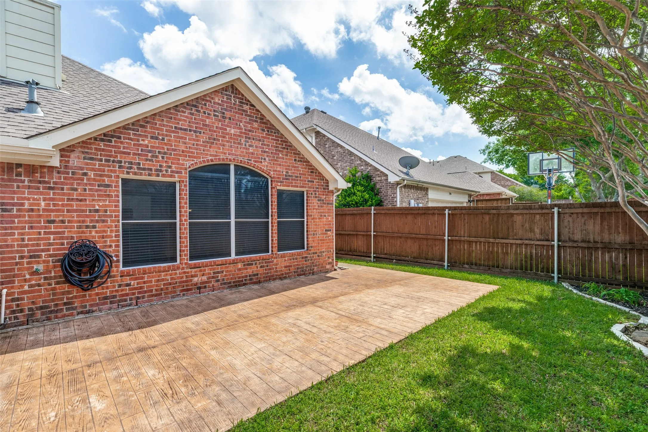 Decorative scored concrete patio provides ample room to enjoy the outdooors.