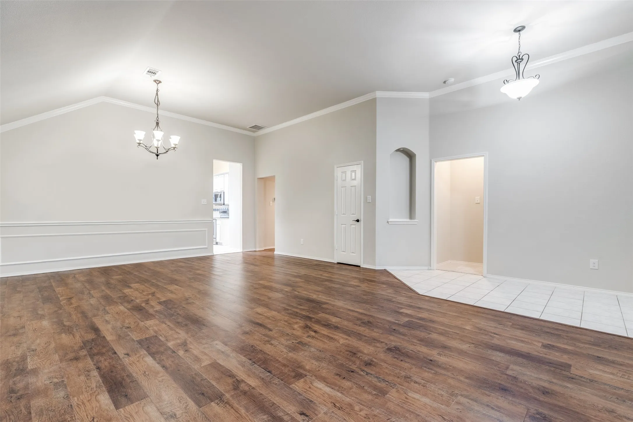 Formals boast chair rail, art niche, and vaulted ceiling.