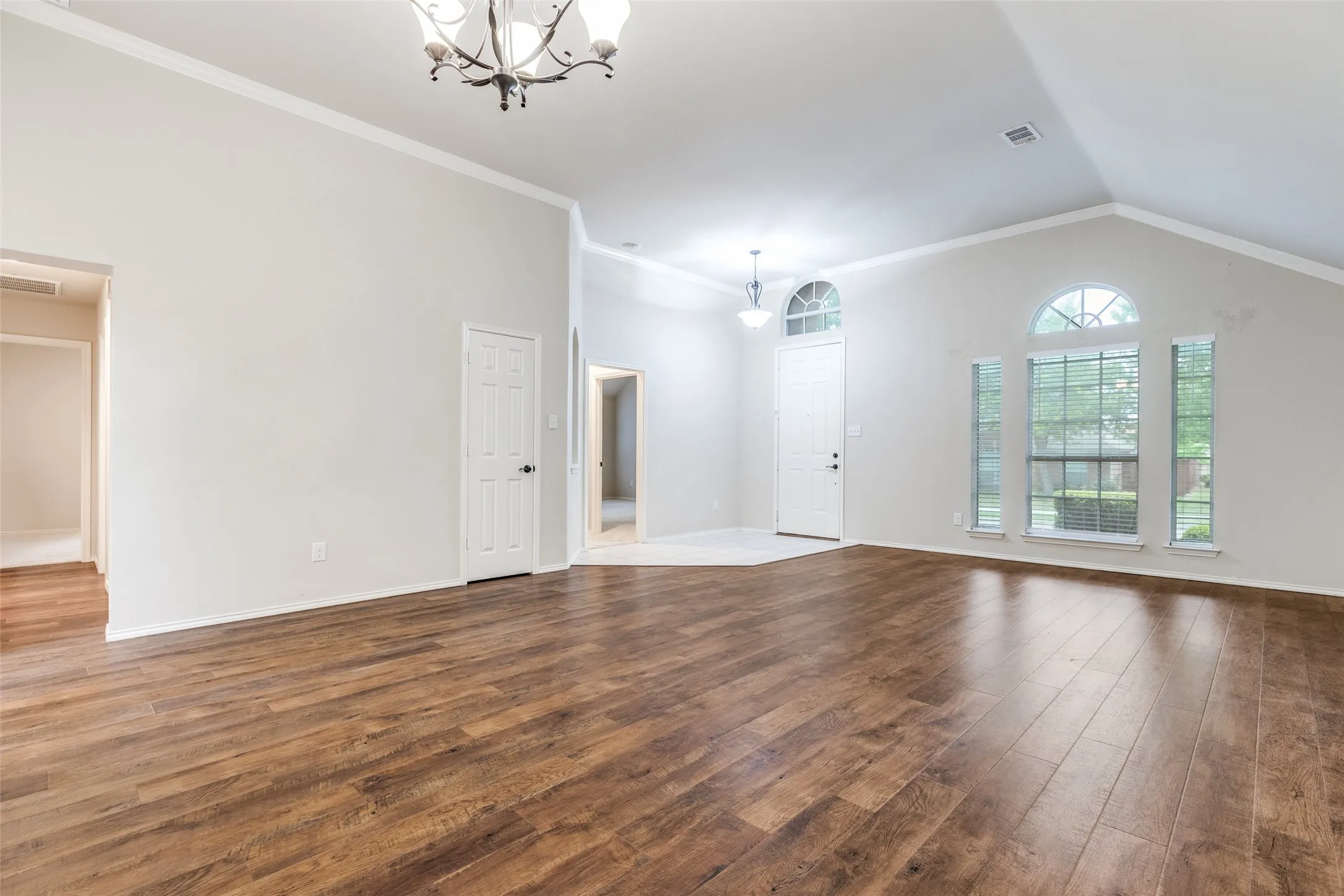 Grand tiled entry opens to huge stacked formal living and dining area.