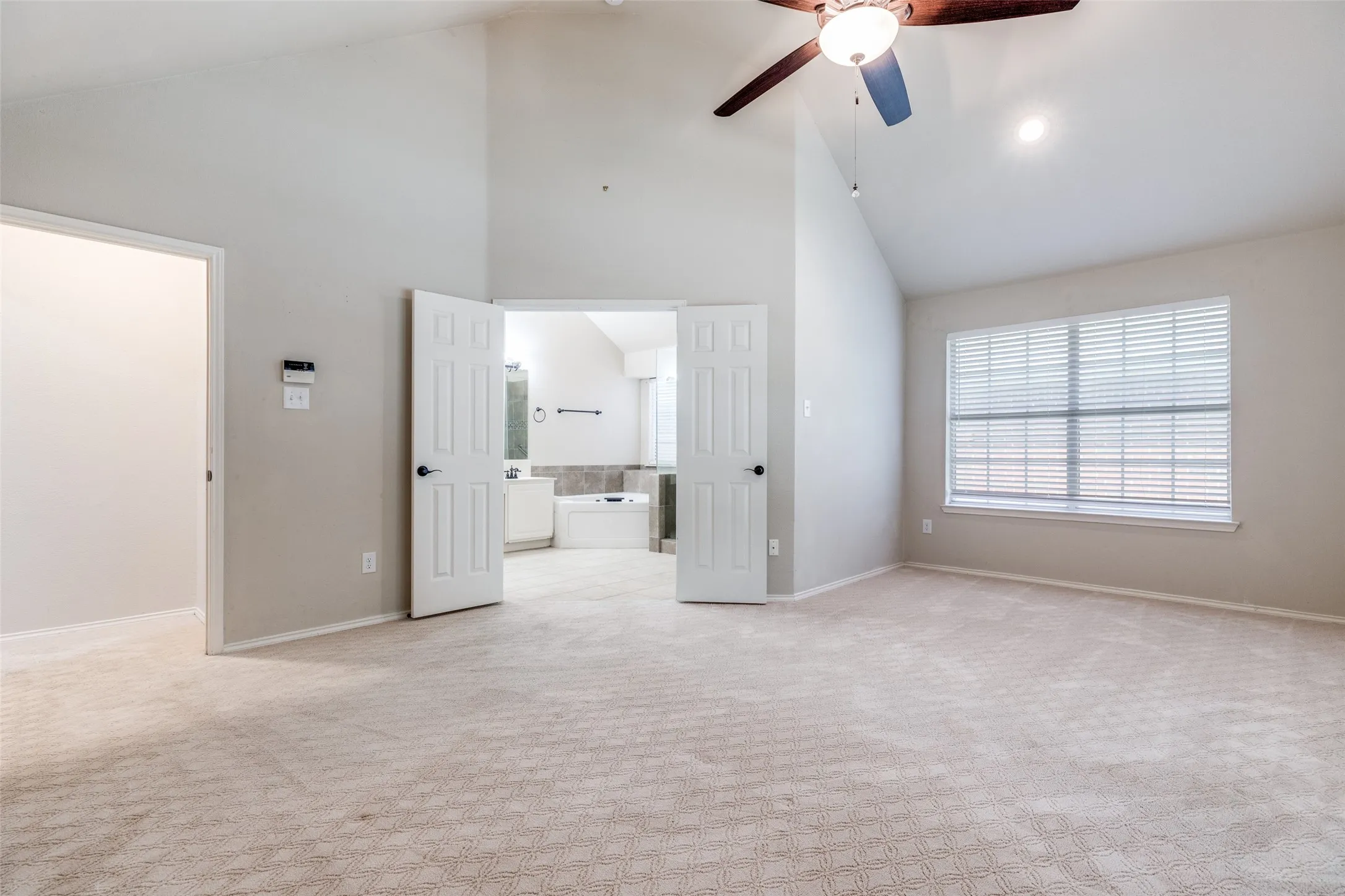 Primary bedroom also large enough for it's own sitting area with it's own window.