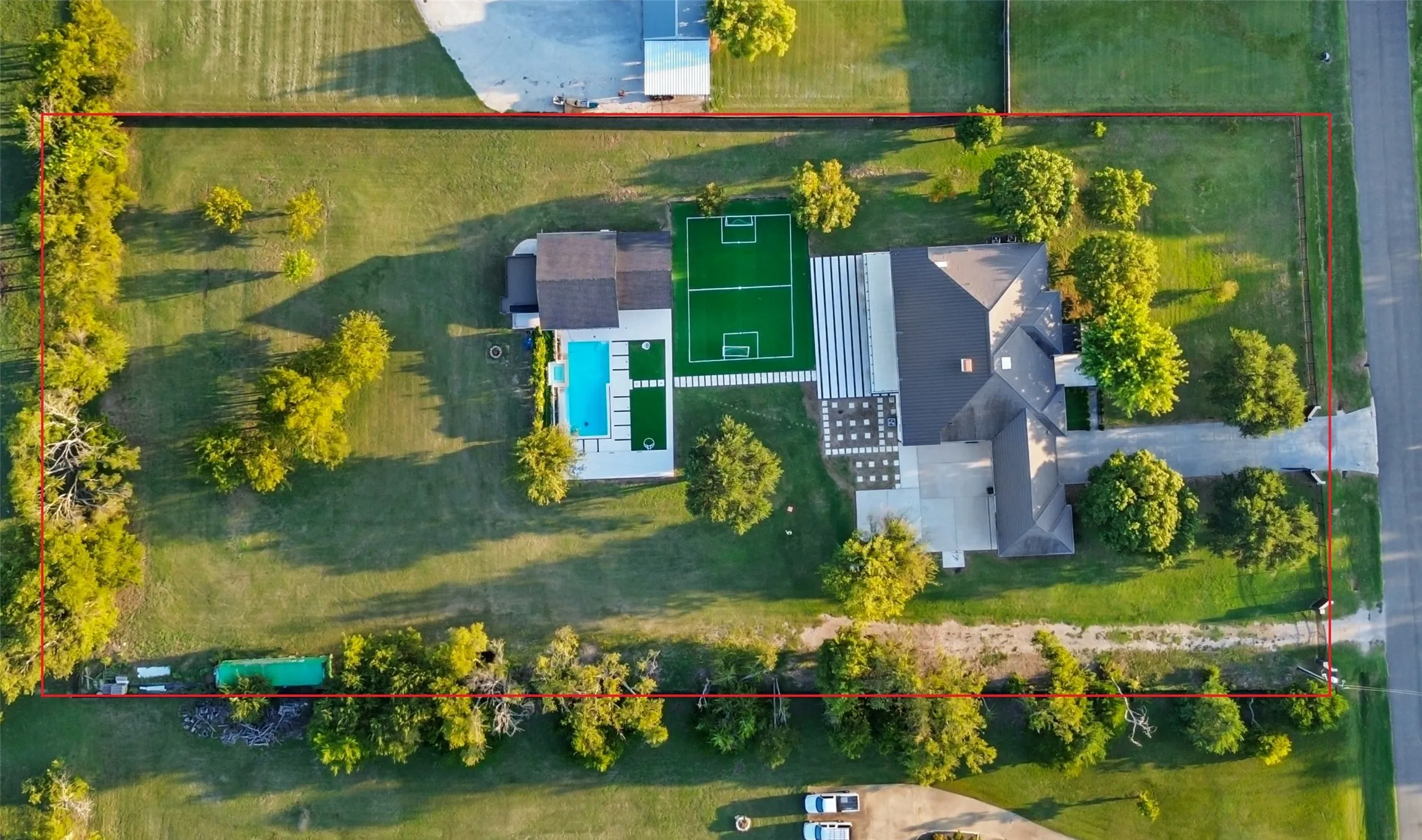 Aerial overview of property's location featuring property boundaries highlighted and a pool area