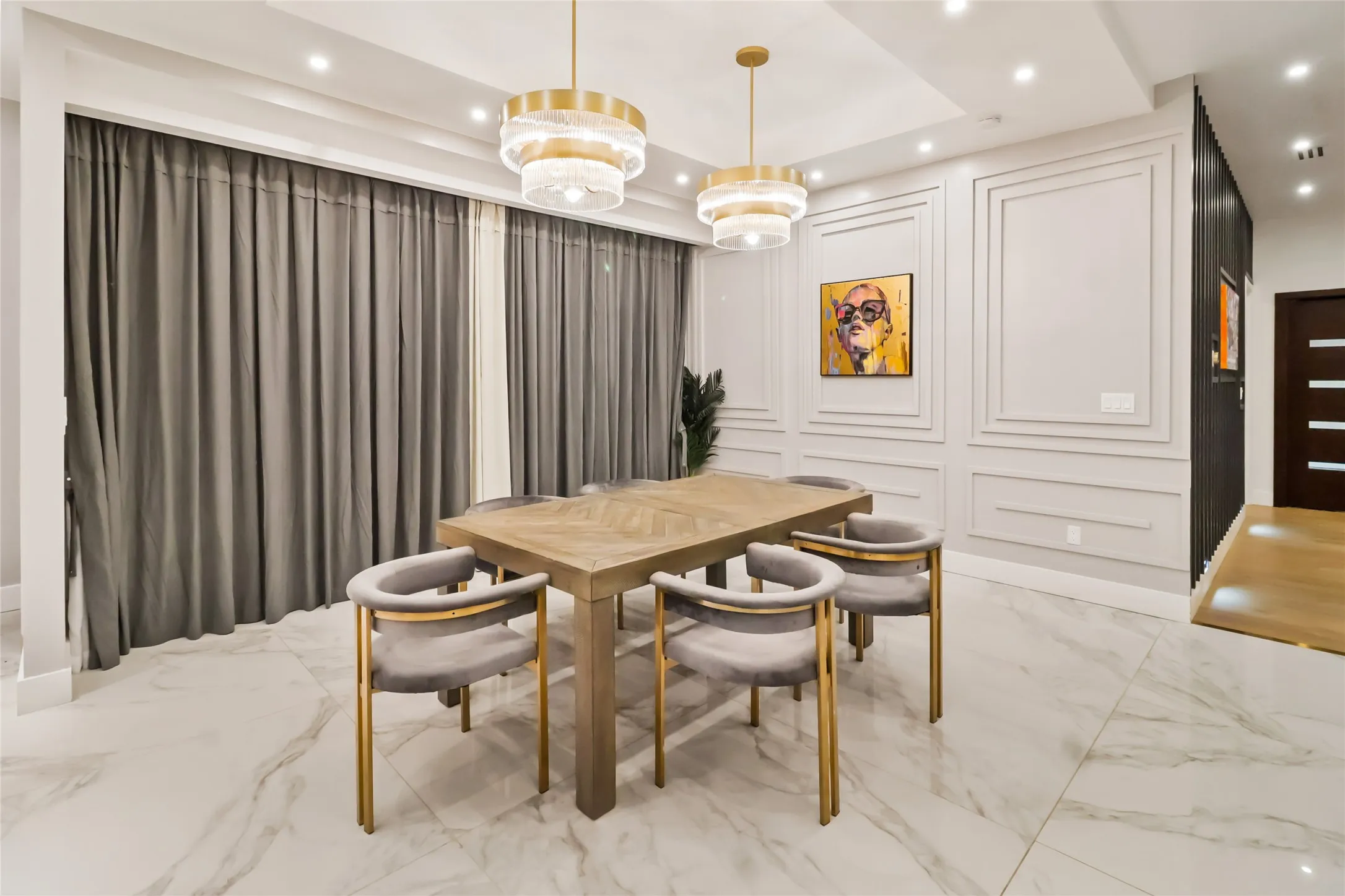 Dining space featuring marble tiled floors, recessed lighting, and a raised ceiling
