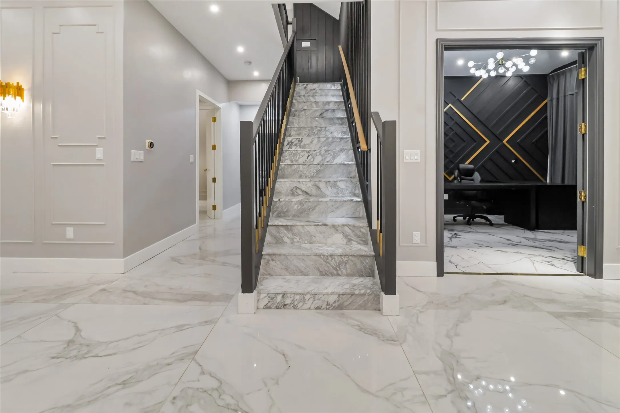 Staircase with marble tiled flooring and recessed lighting