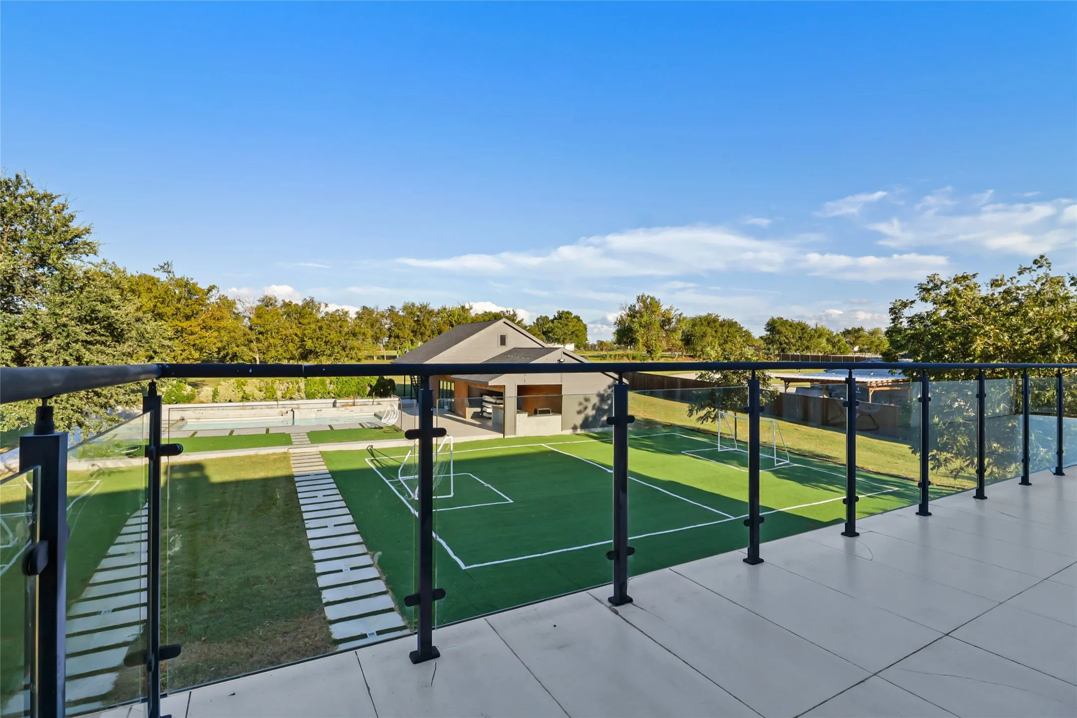 View of community with shuffleboard and a bocce ball area