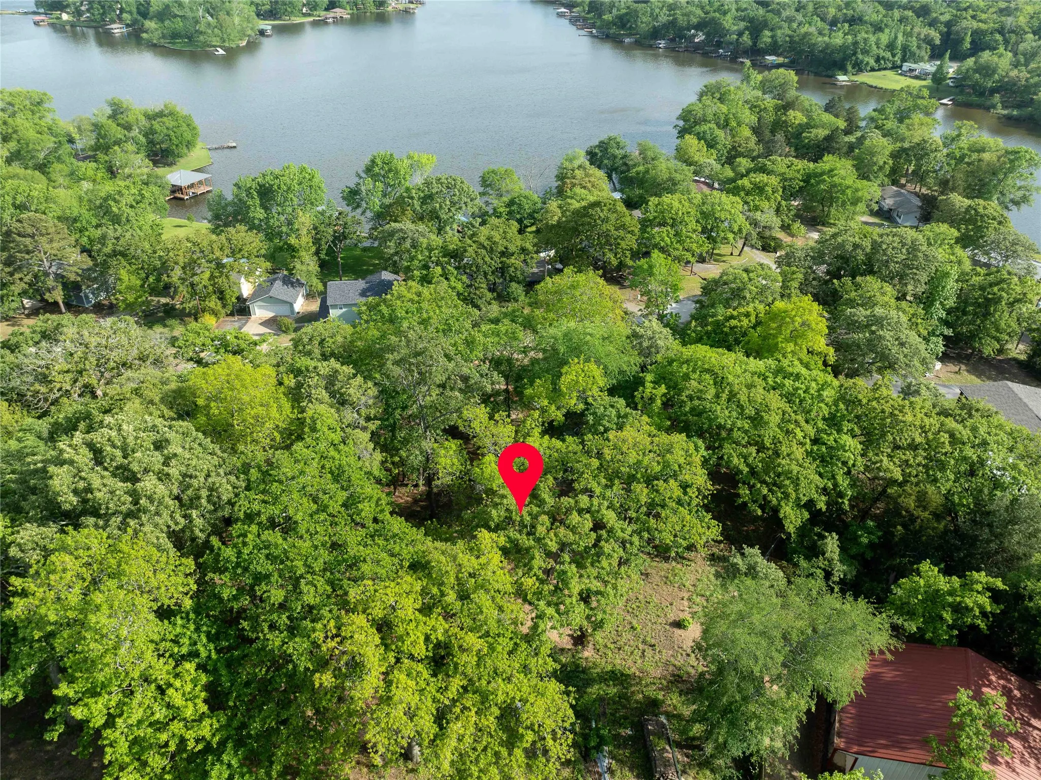 heaving wooded lots with view of lake