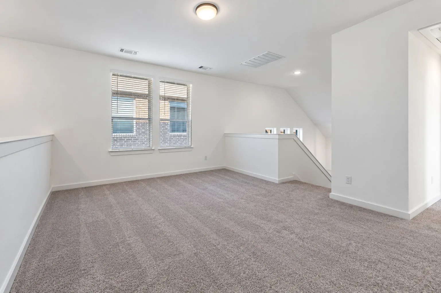 An Additional Living Space Upstairs Overlooks the Main Living Area