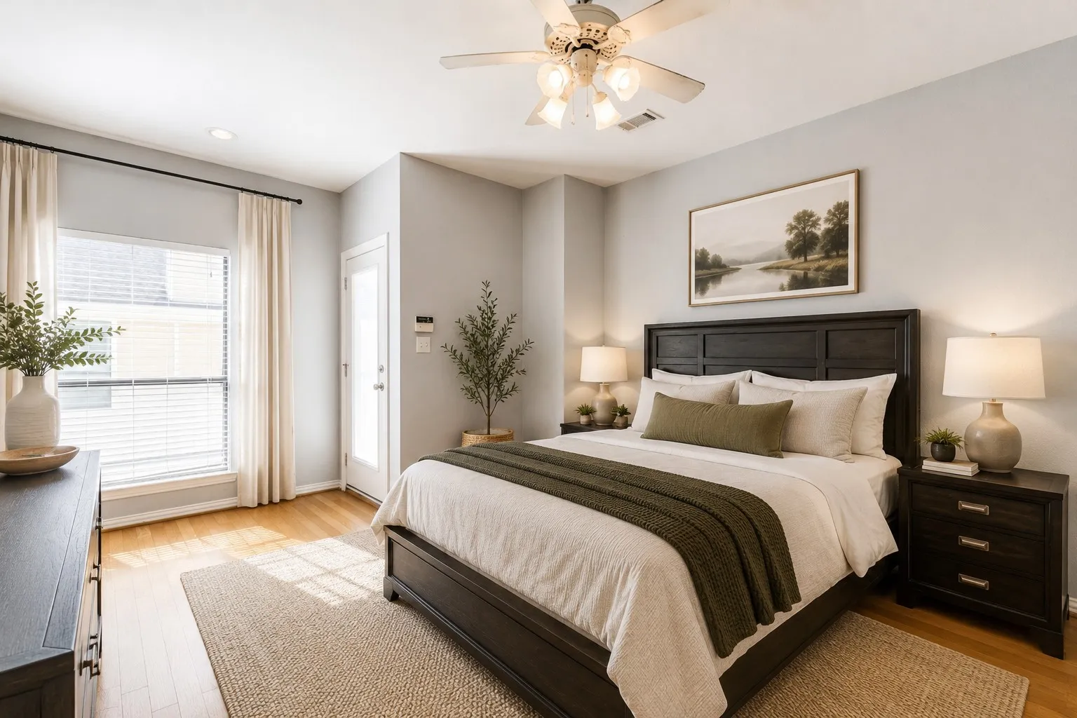 Bedroom featuring a ceiling fan with integrated lighting, a large window with blinds and drapes, a glass-paneled door, and wood-finish flooring