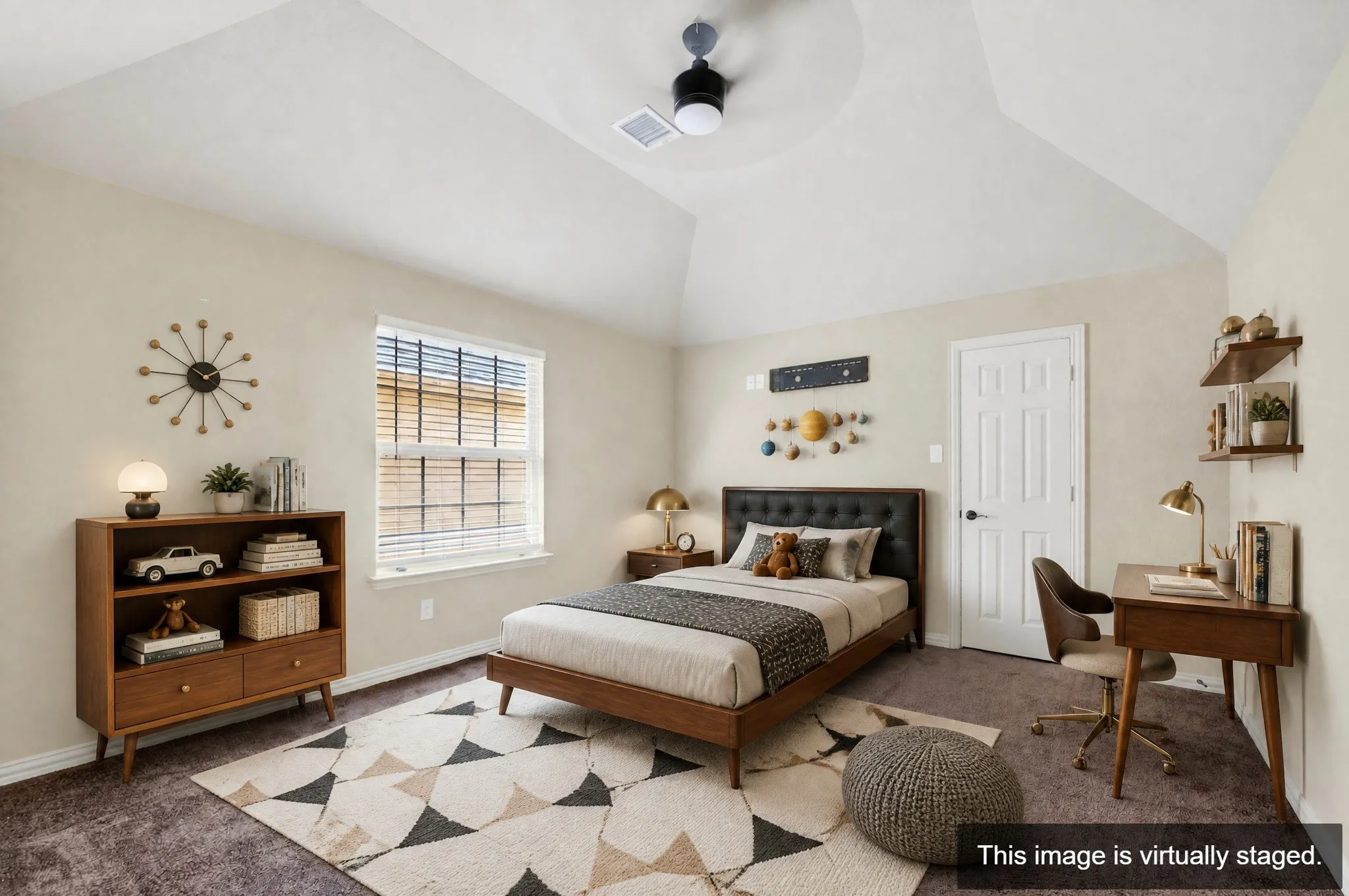 Spacious bedroom featuring a vaulted ceiling with a ceiling fan, a large window with blinds, and neutral-toned walls