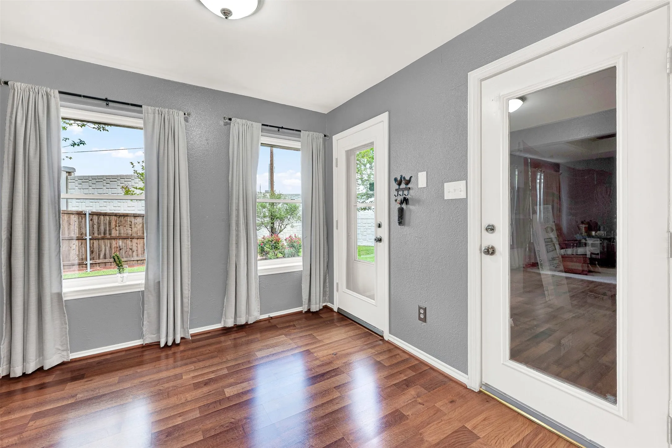 Pretty backyard outside. Door to garage for easy entry with groceries.