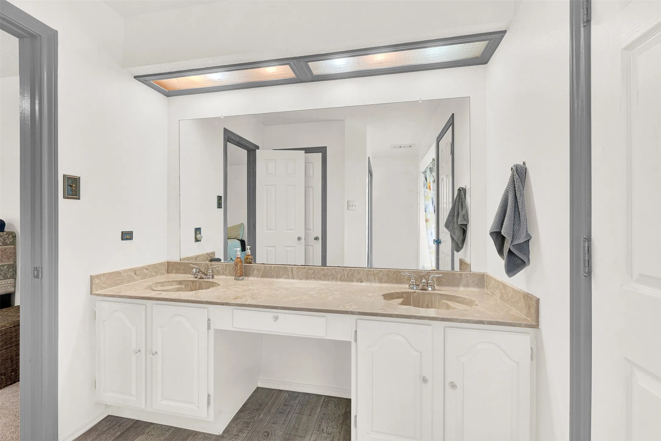 Dual Vanities in the primary bath. 2 more closets in this view.