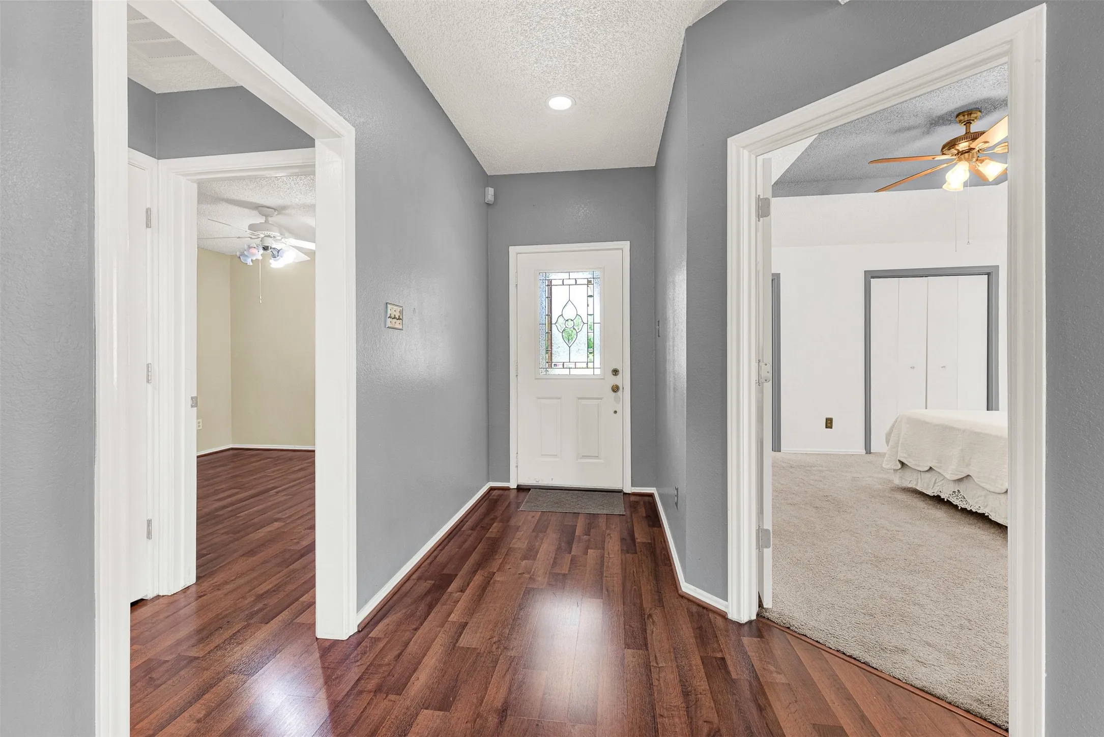Fresh paint with beautiful floors. Primary suite on the right and 2nd bedroom on the left.