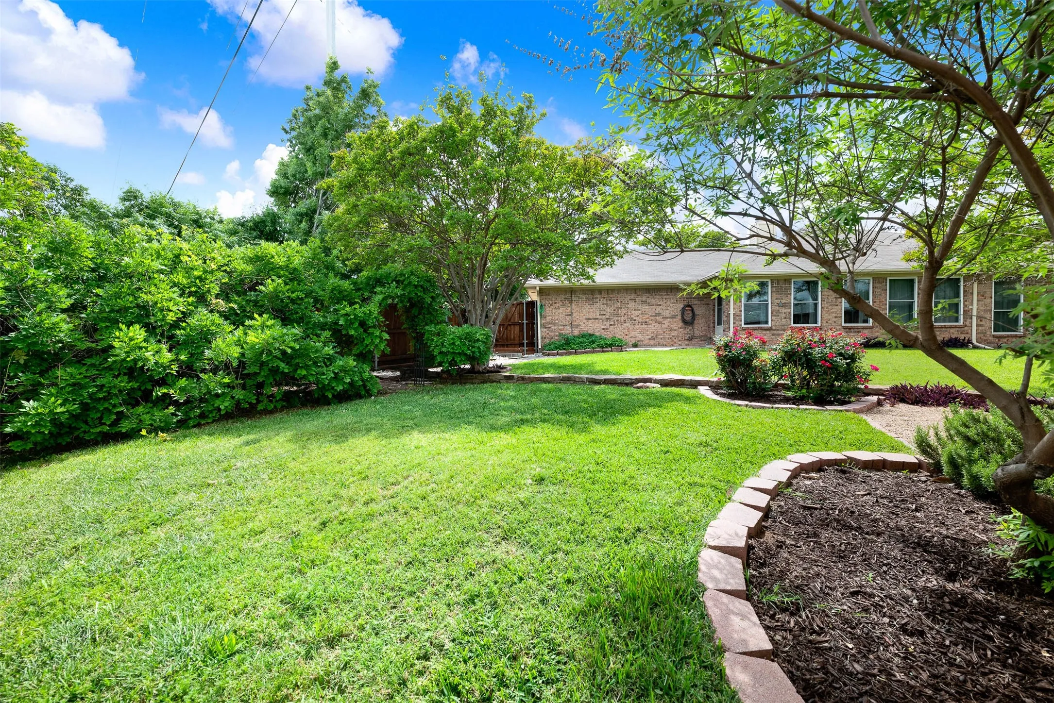 More of this big back yard. you can see all the windows in this view of the back of the home.