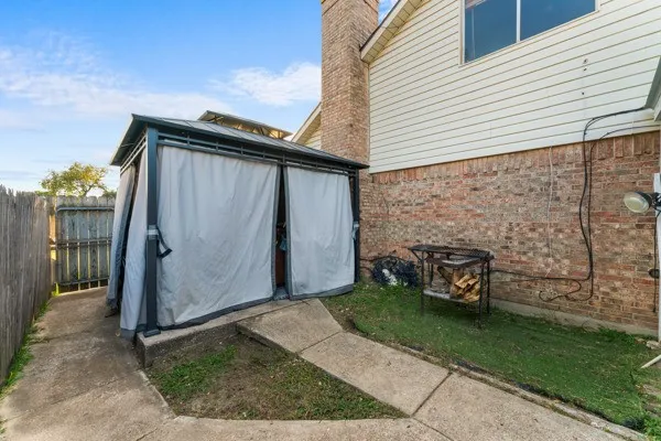 View of shed with a fenced backyard