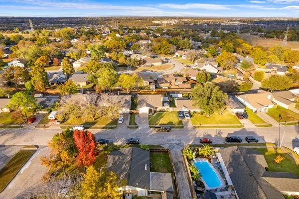 Aerial perspective of suburban area featuring a pool area