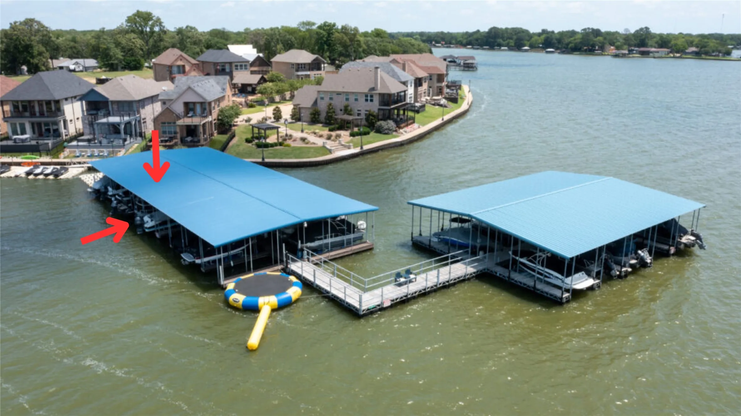 Includes boatslip and lift in community boathouse on deep water plus 2 PWC pods