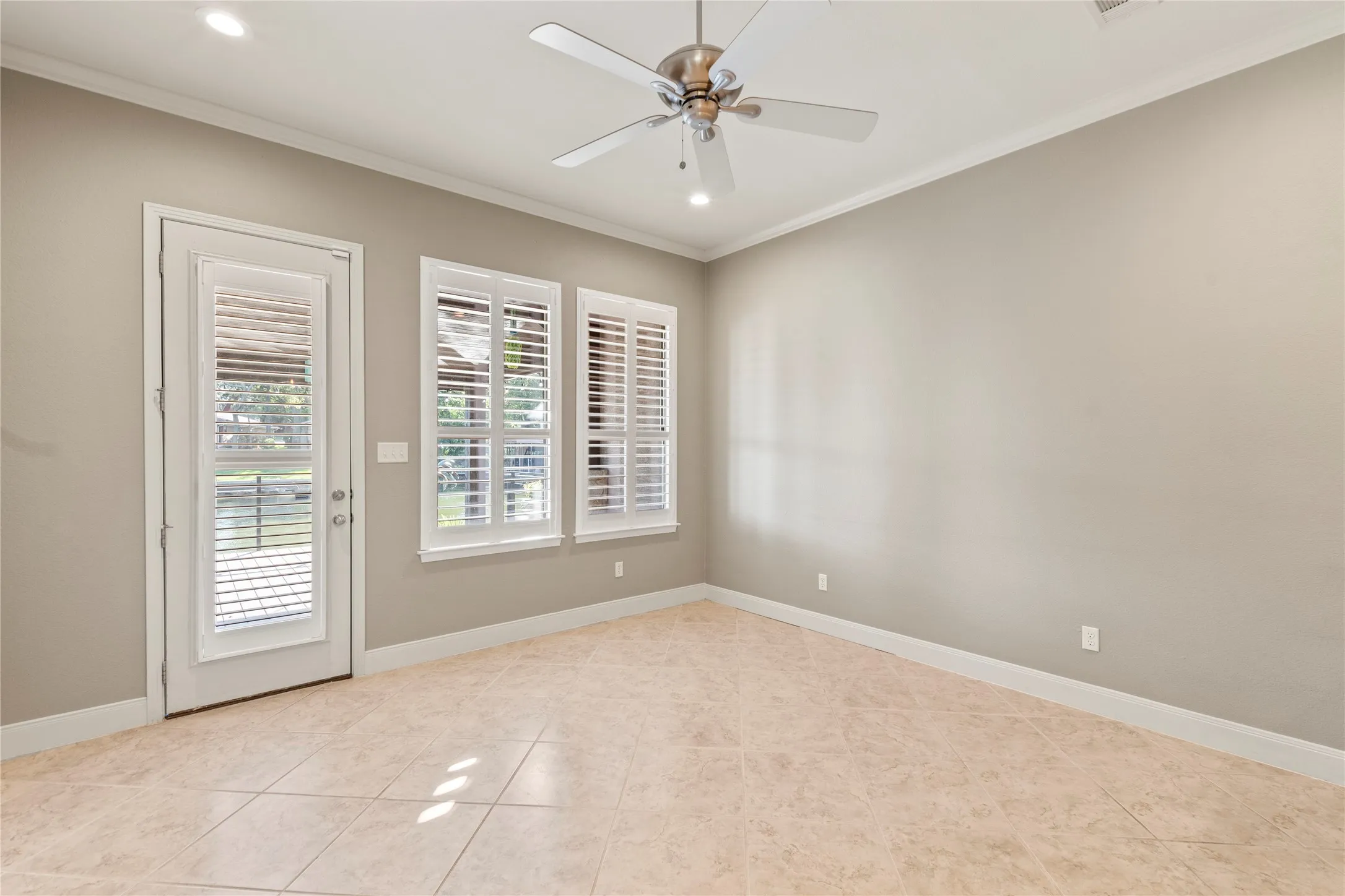 Living room opens to spacious covered waterside deck