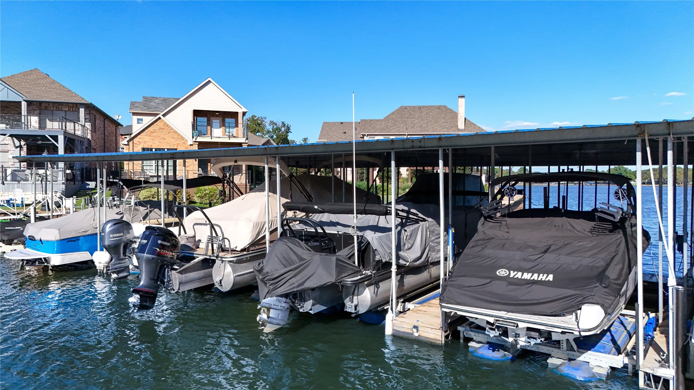 Includes boatslip and lift in community boathouse