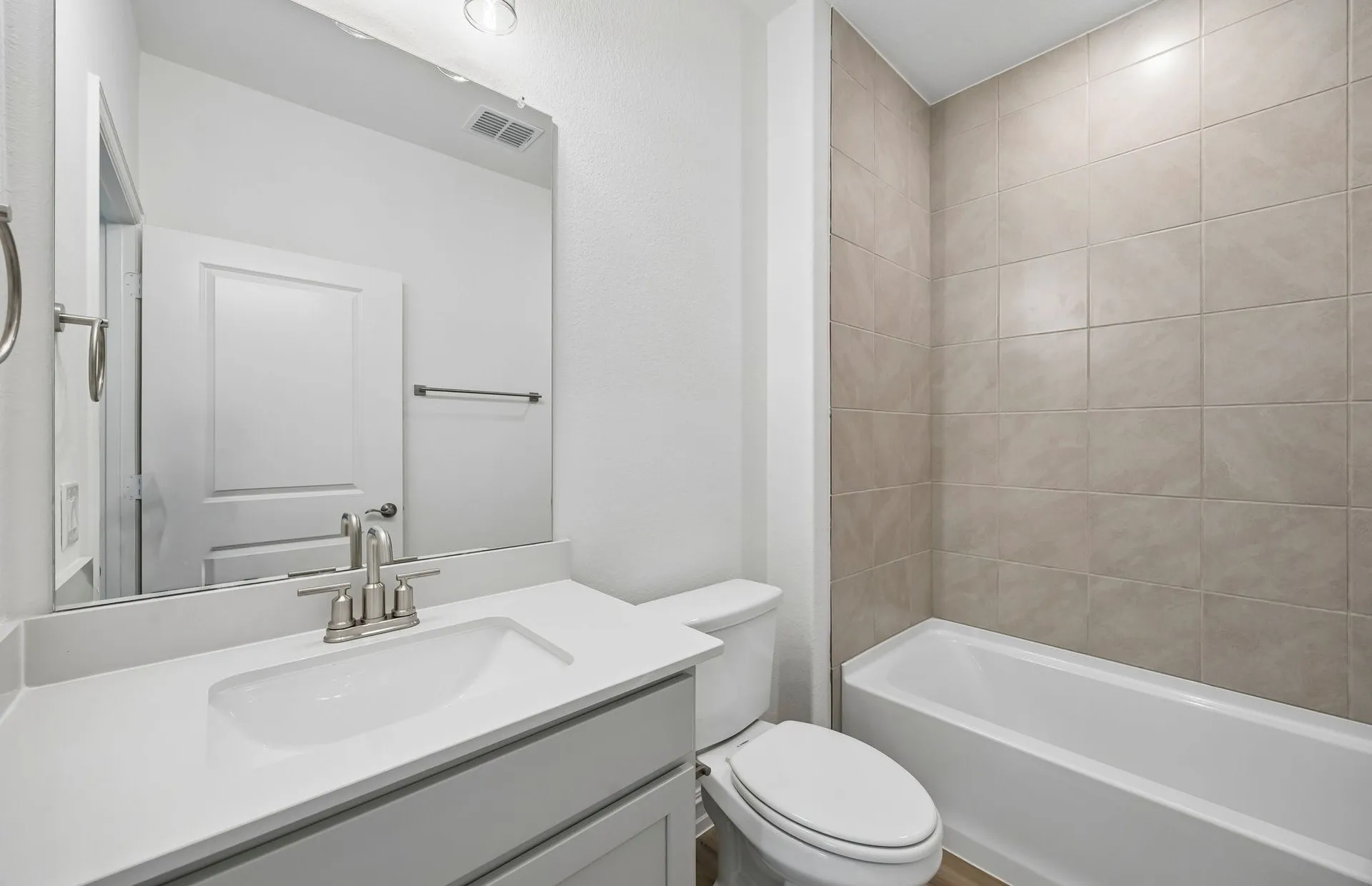 Secondary bath with tile surrounded shower