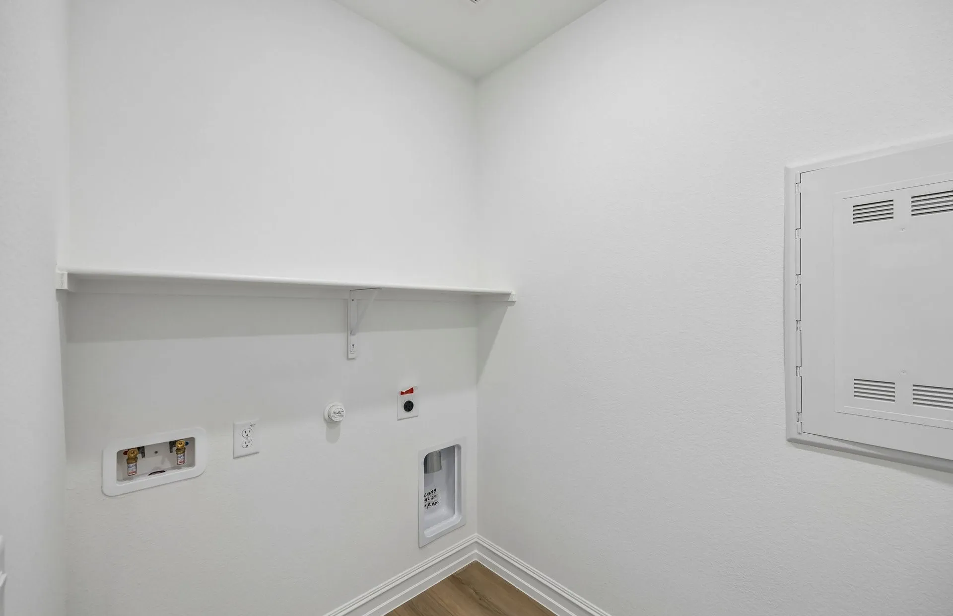 Laundry room with built-in shelving