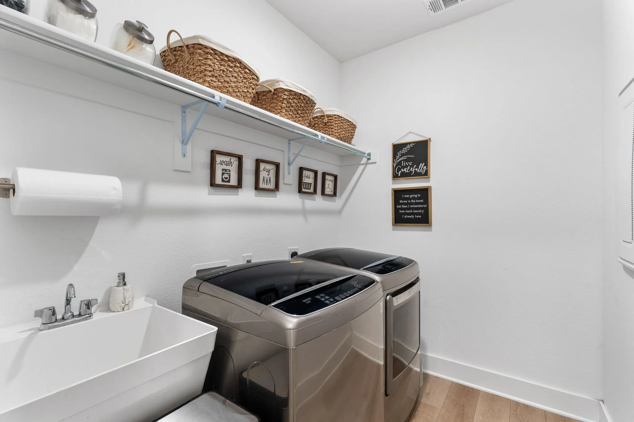 Spacious laundry with sink.