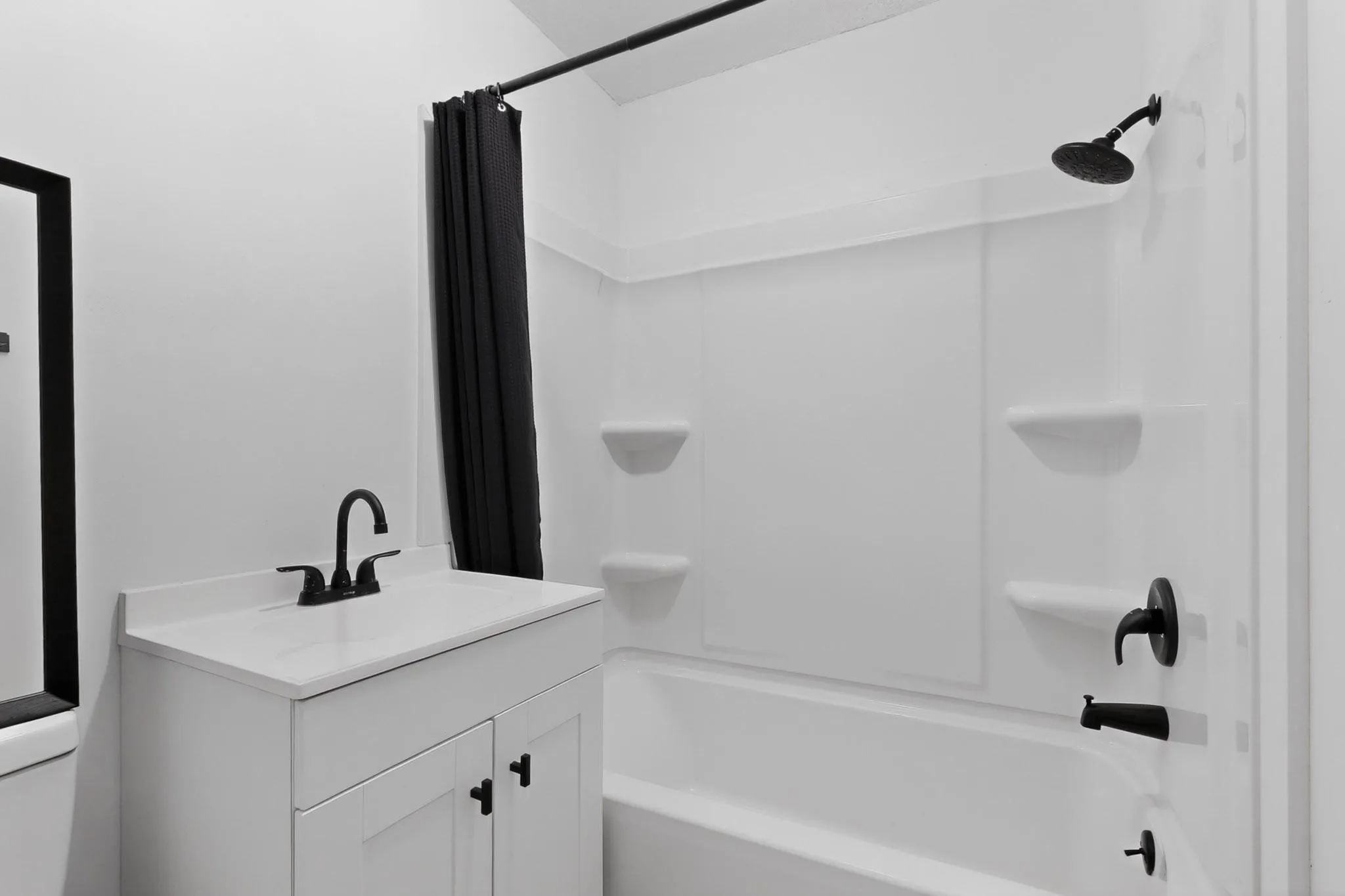 Bathroom featuring a tub-shower combo