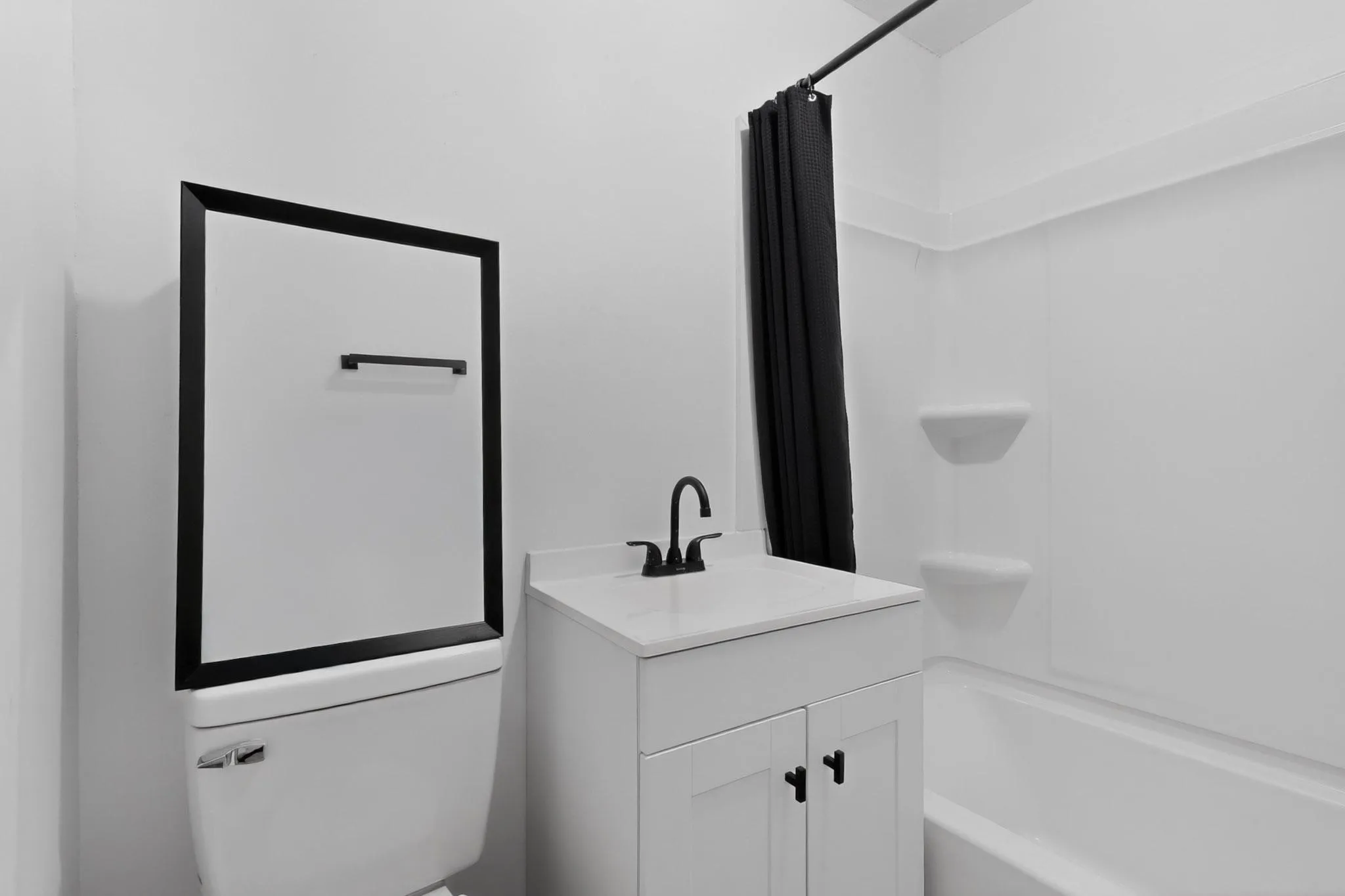 The bathroom features a white vanity.