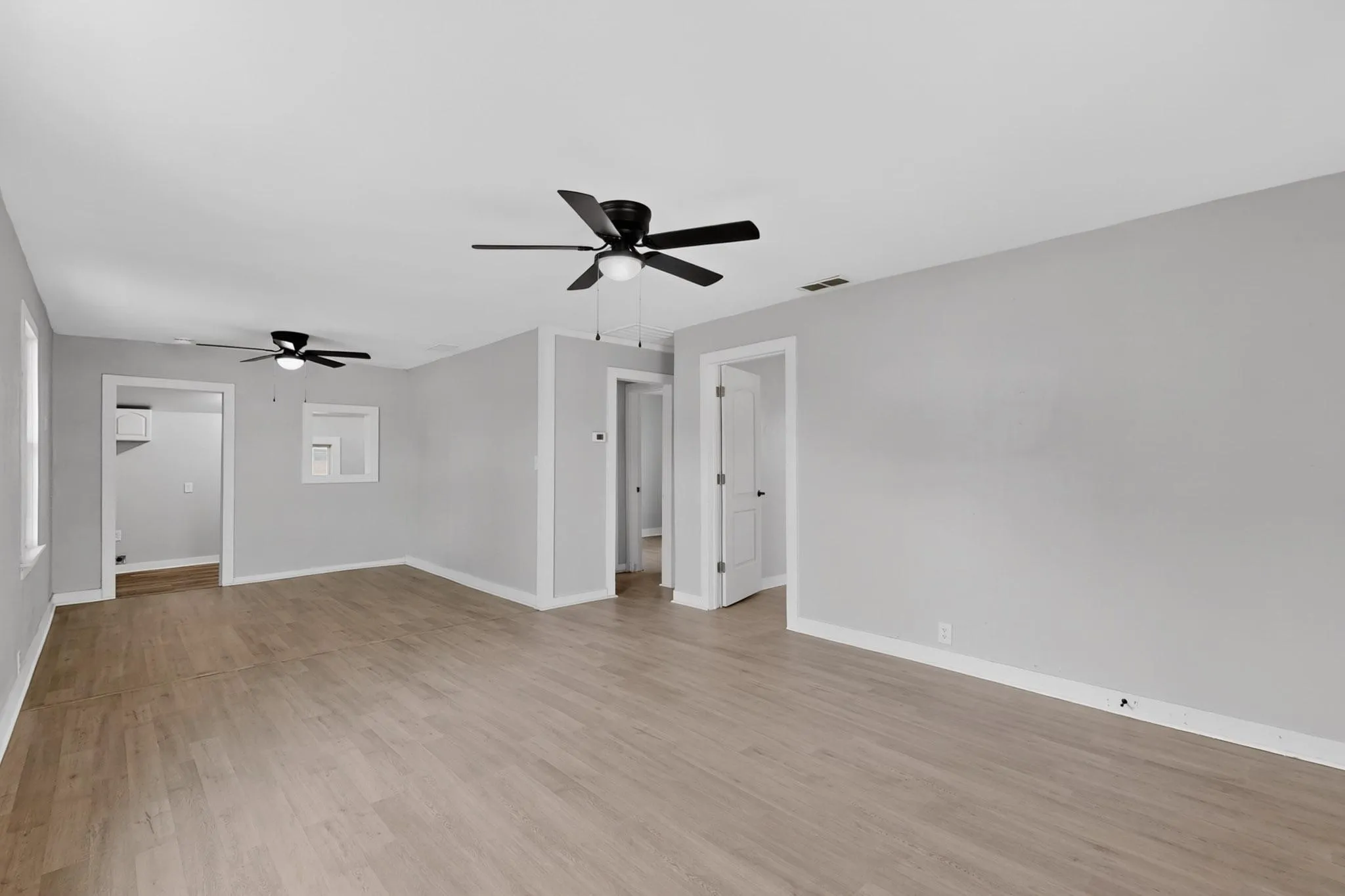 Here you can see the living room and dining room and the doors to the bedrooms.